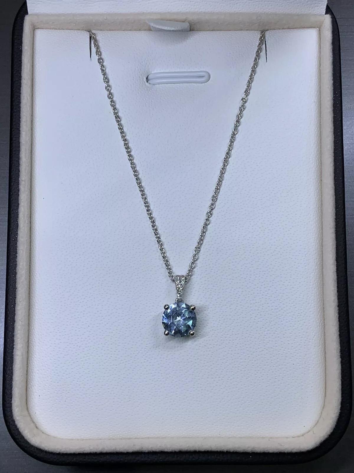 0.80ct Aquamarine and diamond halo pendant necklace in 18k white gold. For Sale 1