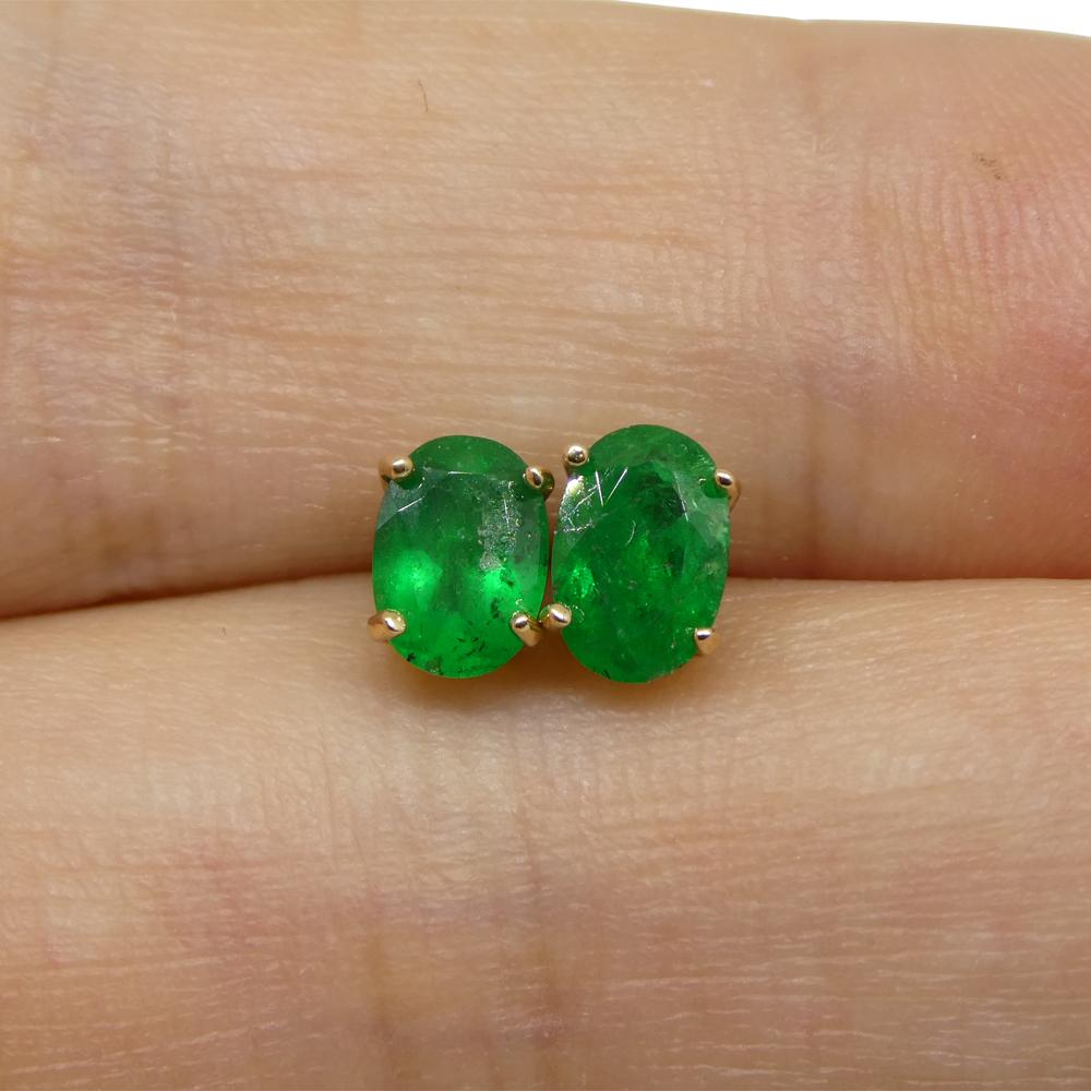 Description:

Stone Type: Emerald
Number of Stones: 2
Weight: 0.80 carats total weight
Measurements: 5.82 x 4.12 mm / 6.25 x 4.15 mm
Shape: Oval
Cutting Style: Crown: Brilliant Cut
Cutting Style: Pavilion: Modified Brilliant Cut
Transparency:
