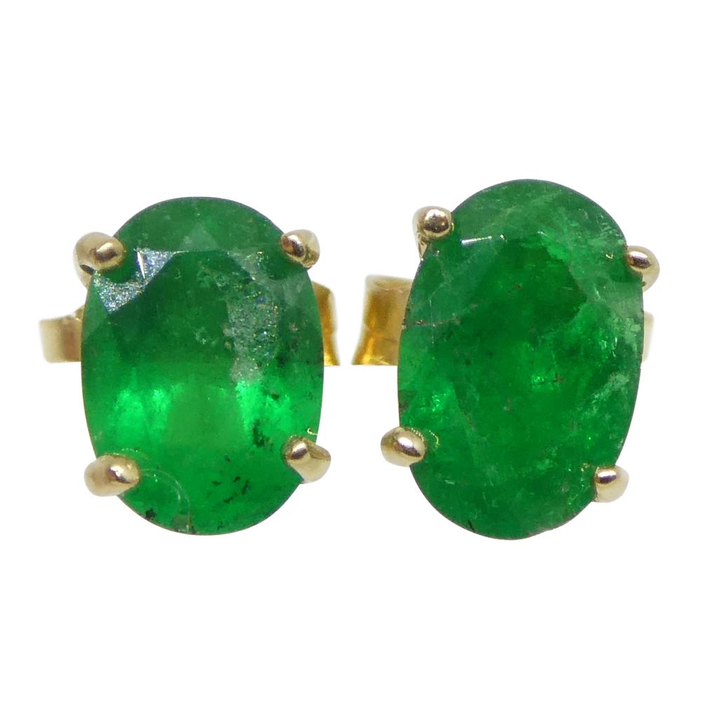 Brilliant Cut 0.80ct Oval Green Colombian Emerald Stud Earrings set in 14k Yellow Gold For Sale