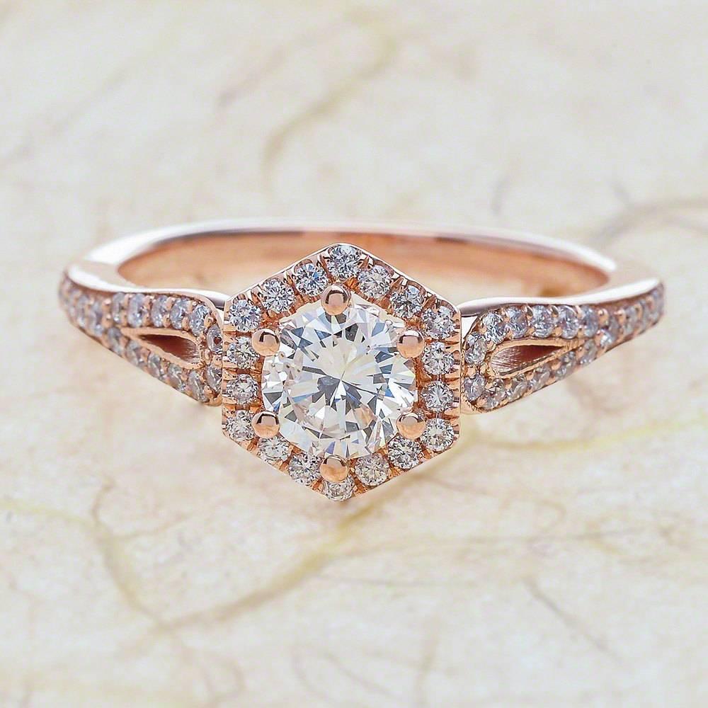 - Center Stone: Round Cut Moissanite 6mm (0.80ct)
- Side Stones: Round Cut Diamonds 0.40ctw / Graded G SI1
- Metal: 14K Rose Gold

This piece is made-to-order. Please allow up to 7 Business Days to accomplish.