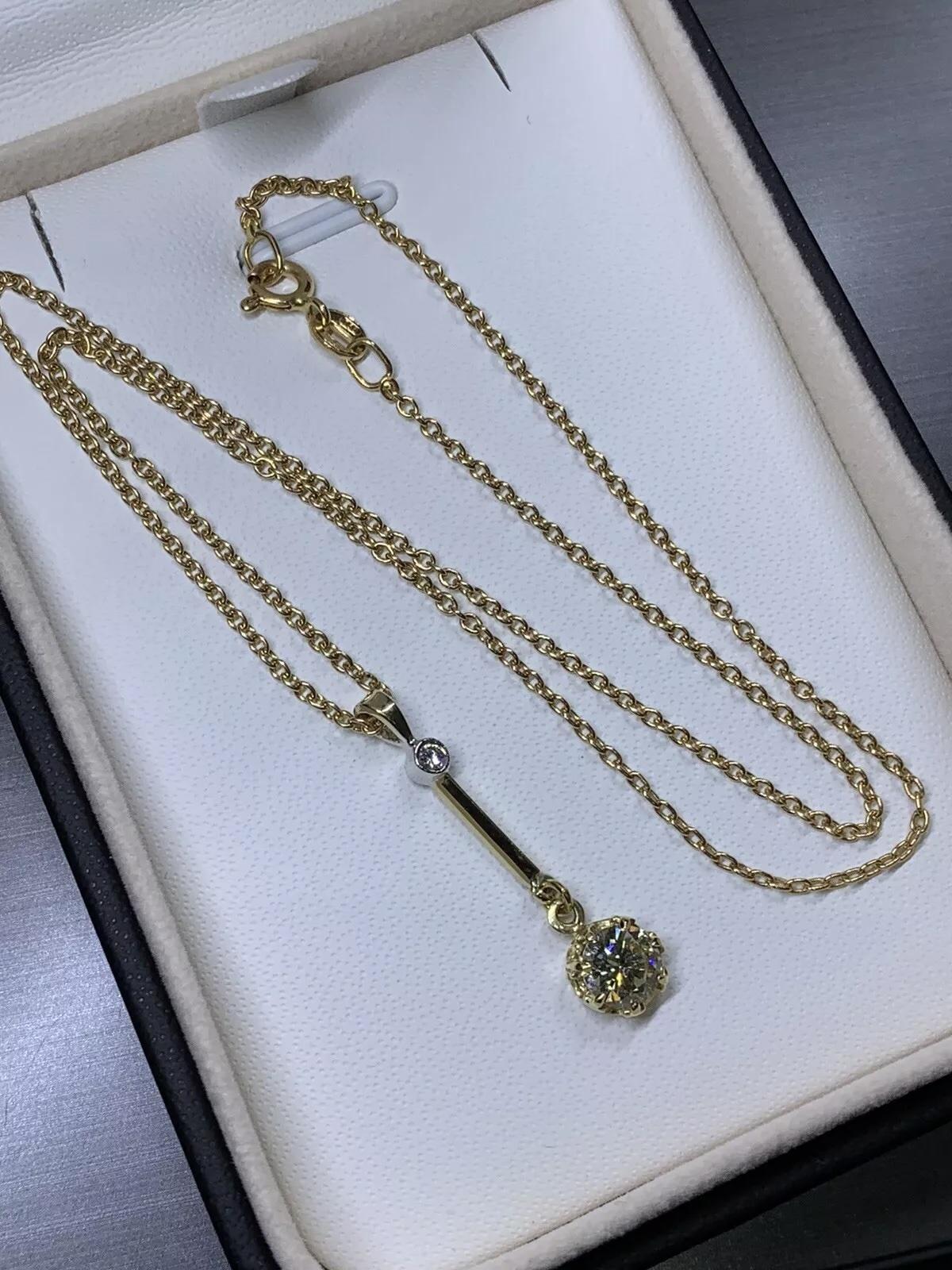 0.80ct Round Diamond Drop Pendant Necklace in 18k yellow gold.

Large elongated drop pendant necklace with diamond floating ball necklace in 18k yellow gold.

Hallmarked.

Length 18 inches

Small diamond total weight 0.05ct F colour VS1