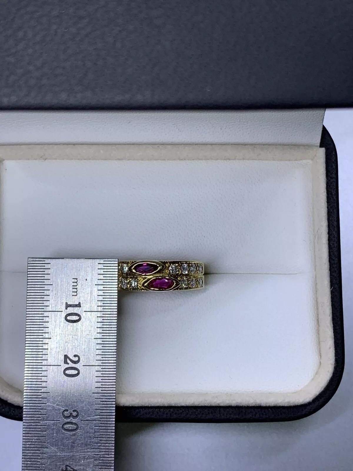 0.80ct Ruby marquise diamond engagement ring in 18k yellow gold.

Ruby marquise natural untreated gemstone vivid colour total weight 0.30ct

Diamonds G colour VS2 clarity total weight 0.80ct

Hallmarked

The ring can be resized

Box and valuation