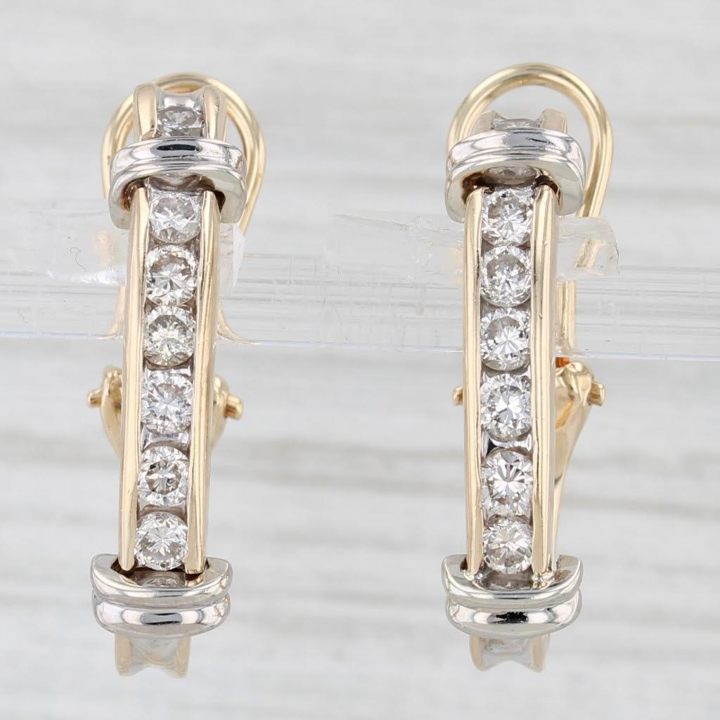 Gemstone Information:
- Natural Diamonds -
Total Carats - 0.80ctw
Cut - Round Brilliant
Color - J - L
Clarity - SI1 - SI2

Metal: 14k Yellow & White Gold
Weight: 7.3 Grams 
Stamps: 14k
Closure: Stick Posts & Omega Backs
Measurements: 24 x 5.9 mm