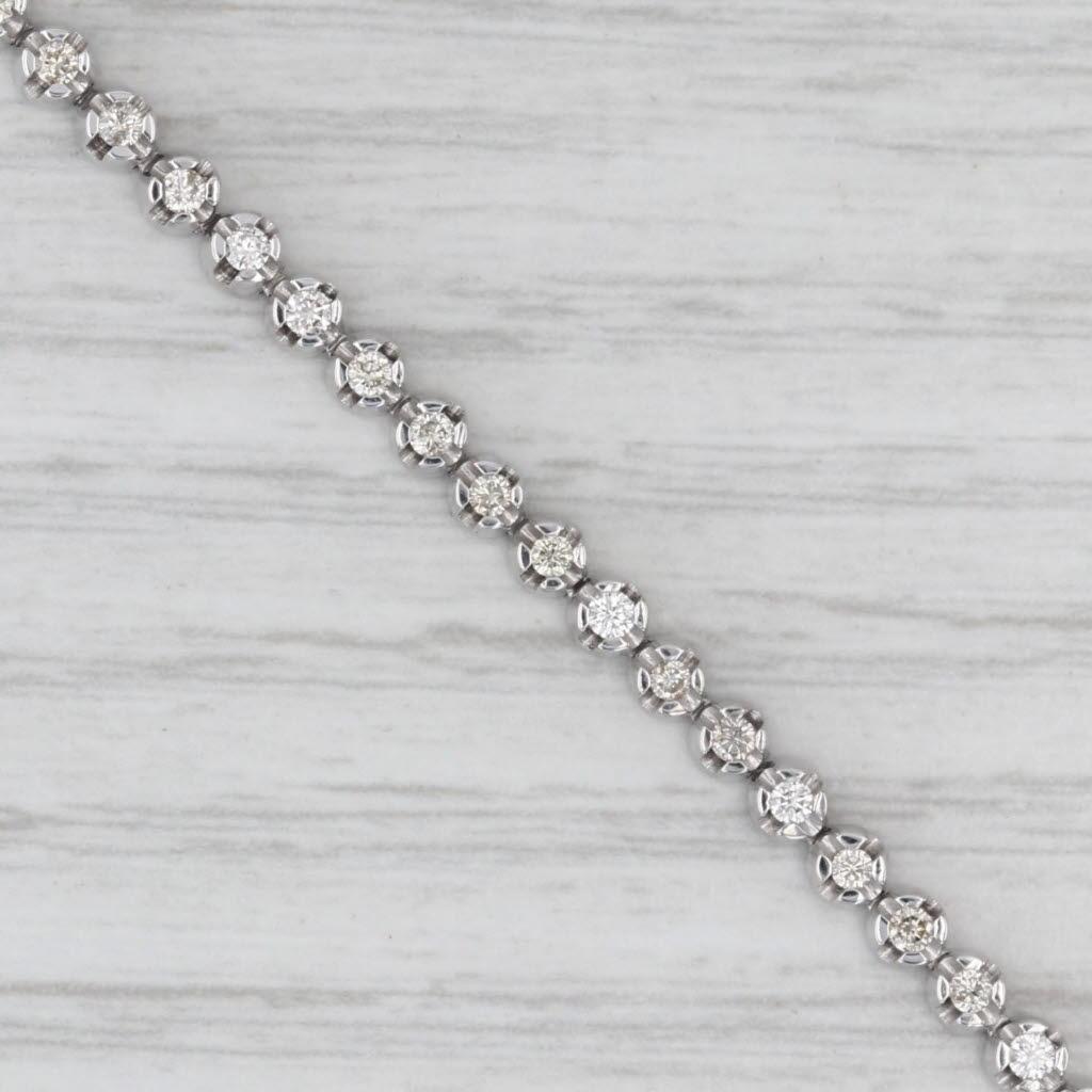 Gemstone Information:
- Natural Diamonds -
Total Carats - 0.80ctw
Cut - Round Brilliant
Color - H - K
Clarity - VS2 - SI1

Metal: 10k White Gold
Weight: 8.1 Grams 
Stamps: 10k
Chain Style: Tennis
Closure: Box
Inner Circumference: 6 3/4