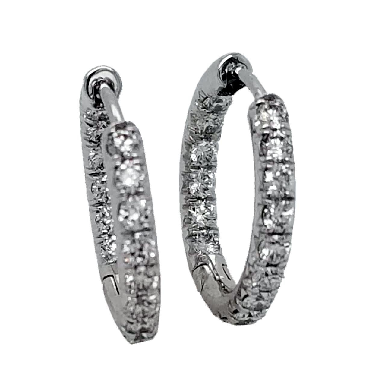 This beautiful 14K Gold Inside/Outside hoop earrings (Huggies) has 32 round brilliant diamonds with total weight of 0.81 Ct set in French Pave style for maximum brilliance. The earring is 16 mm in diameter.