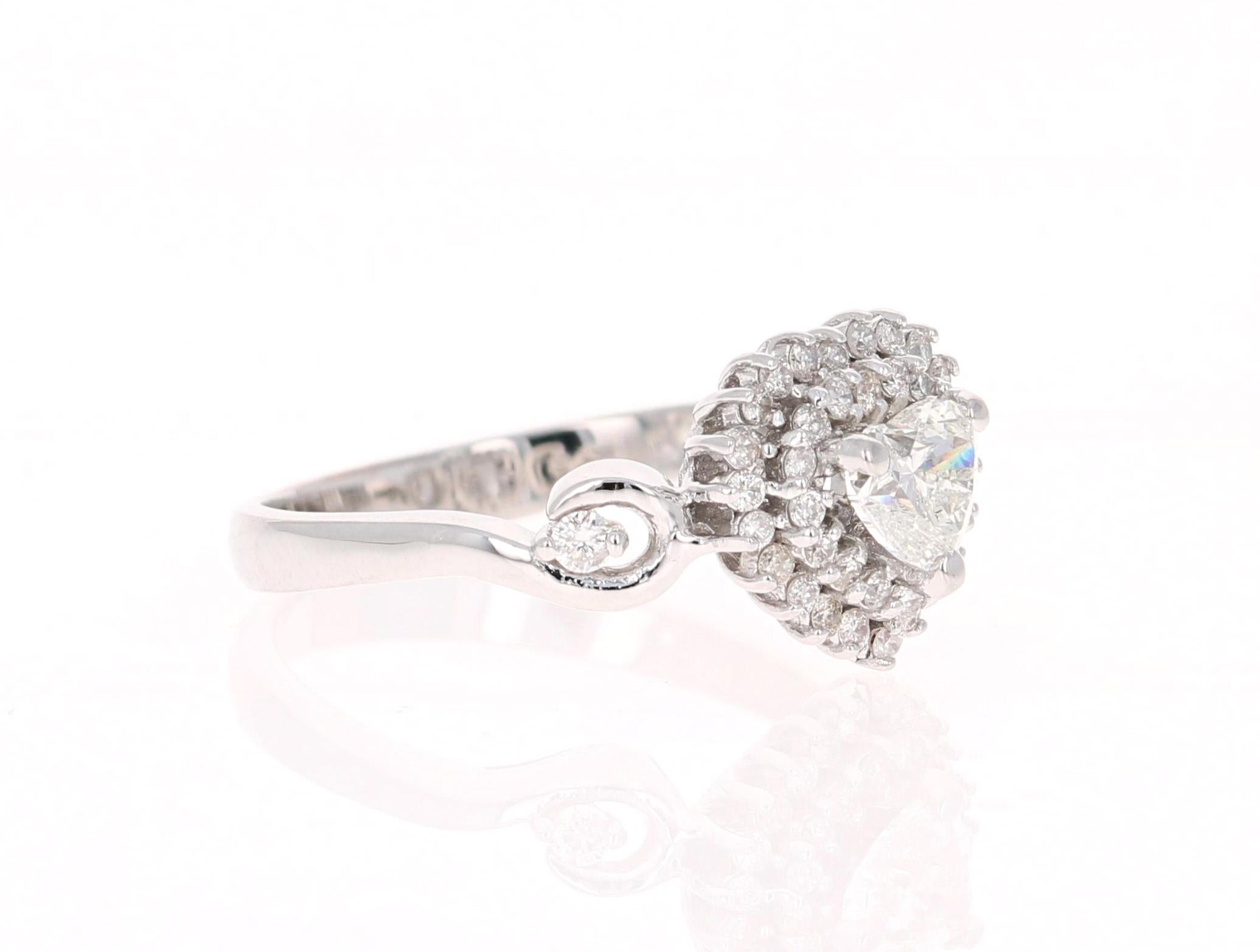 A Beautiful and Unique Engagement Ring with a Heart Cut Diamond. 

This unique ring has a heart cut diamond weighing 0.51 Carats and is surrounded by 41 Round Cut Diamonds that weigh 0.30 Carats.  (Clarity: SI, Color: F) 

It is beautifully set in