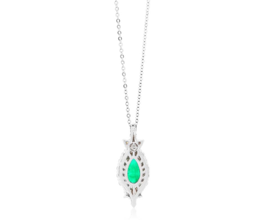 Material: 14k White Gold 
Center Stone Details: 1 Pear Shaped Emerald at 0.81 Carats- Measuring 9.3 x 5 mm
Diamond Details: 24 Brilliant White Diamonds at 0.46 Carats - Clarity: SI / Color: H-I

Fine one-of-a kind craftsmanship meets incredible