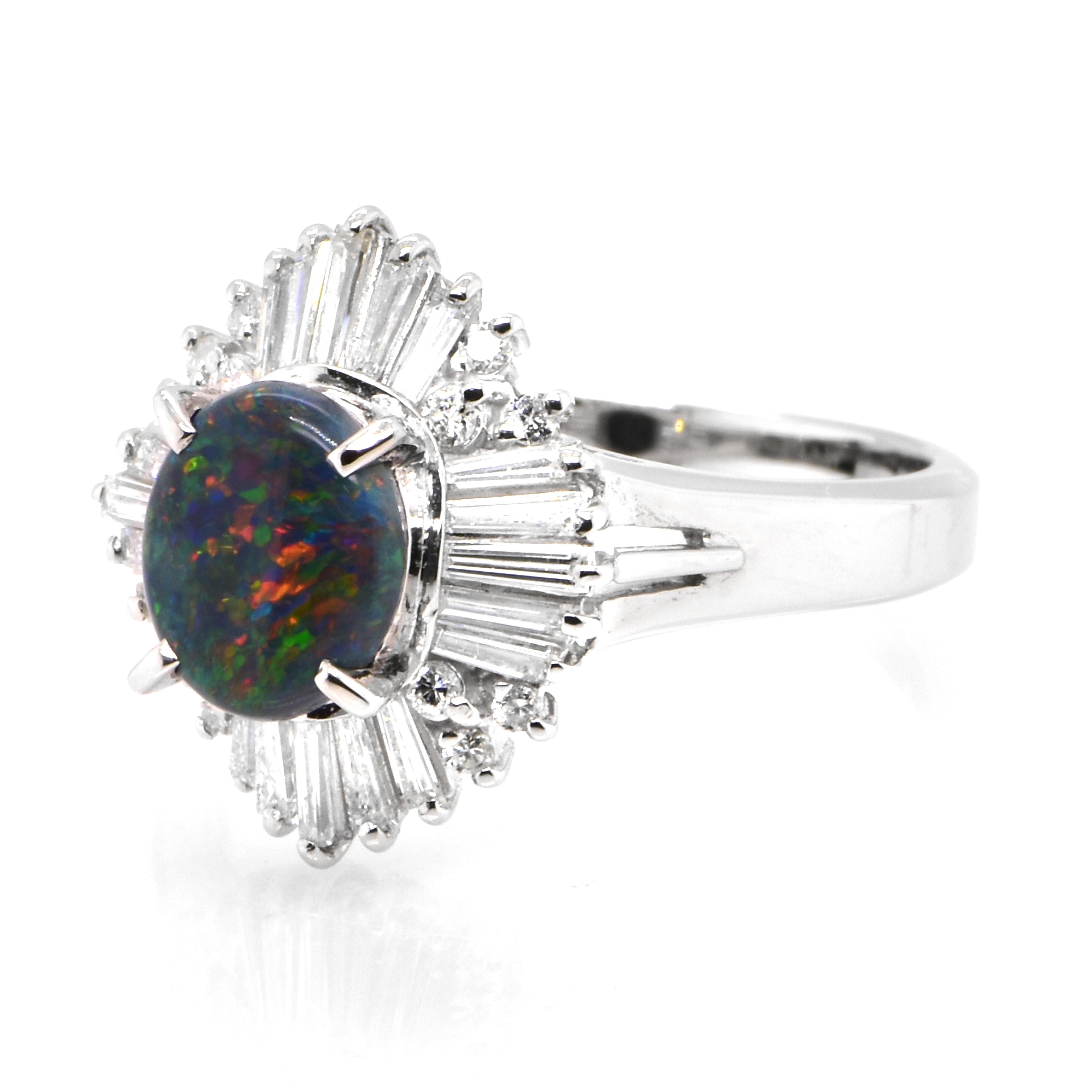 A beautiful ring featuring a 0.81 Carat, Natural, Australian Black Opal and 0.44 Carats of Diamond Accents set in Platinum. The Opal displays very good play of color! Opals are known for exhibiting flashes of rainbow colors known as 