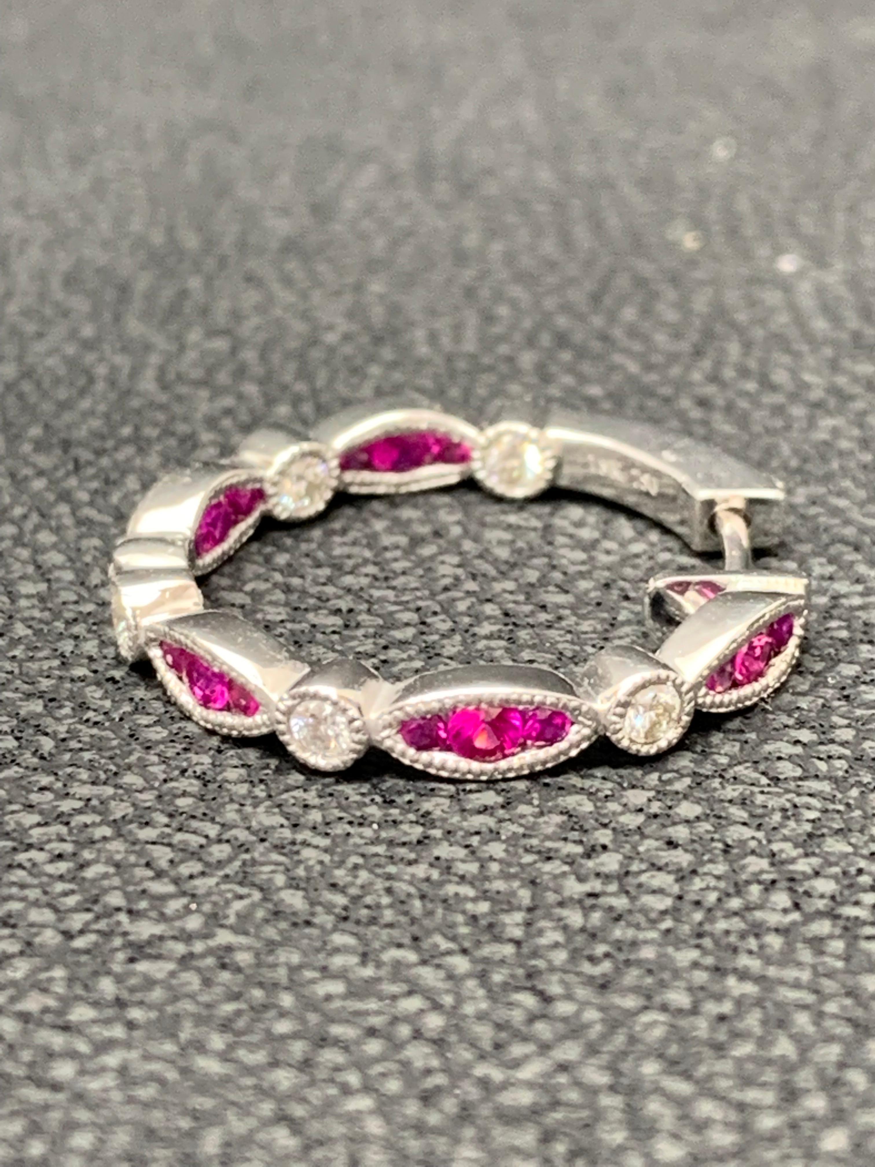 A unique piece of hoop earrings showcasing a row of  20 round Rubies and 10 diamonds, set in a bezel made in 18k white gold. Rubies weigh 0.81 carat and Diamonds weigh 0.26 carats total.
Style available in different price ranges. Prices are based on