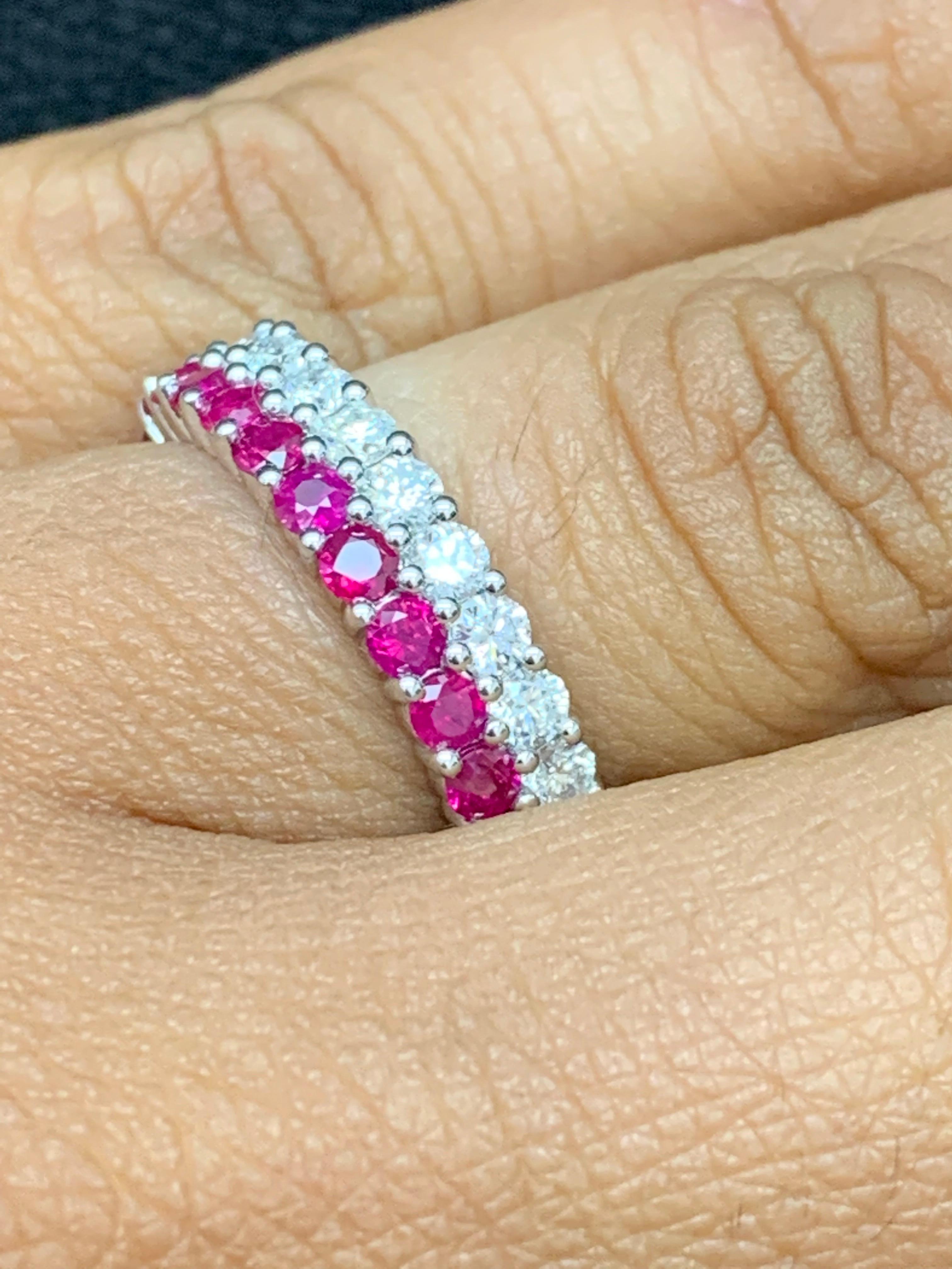 A unique and fashionable ring showcasing two rows of round-shape 13 rubies and 14 diamonds, set in a band design. Rubies weigh 0.81 carats and Diamonds weigh 0.70 carats total. A brilliant and masterfully-made piece.

Style available in different
