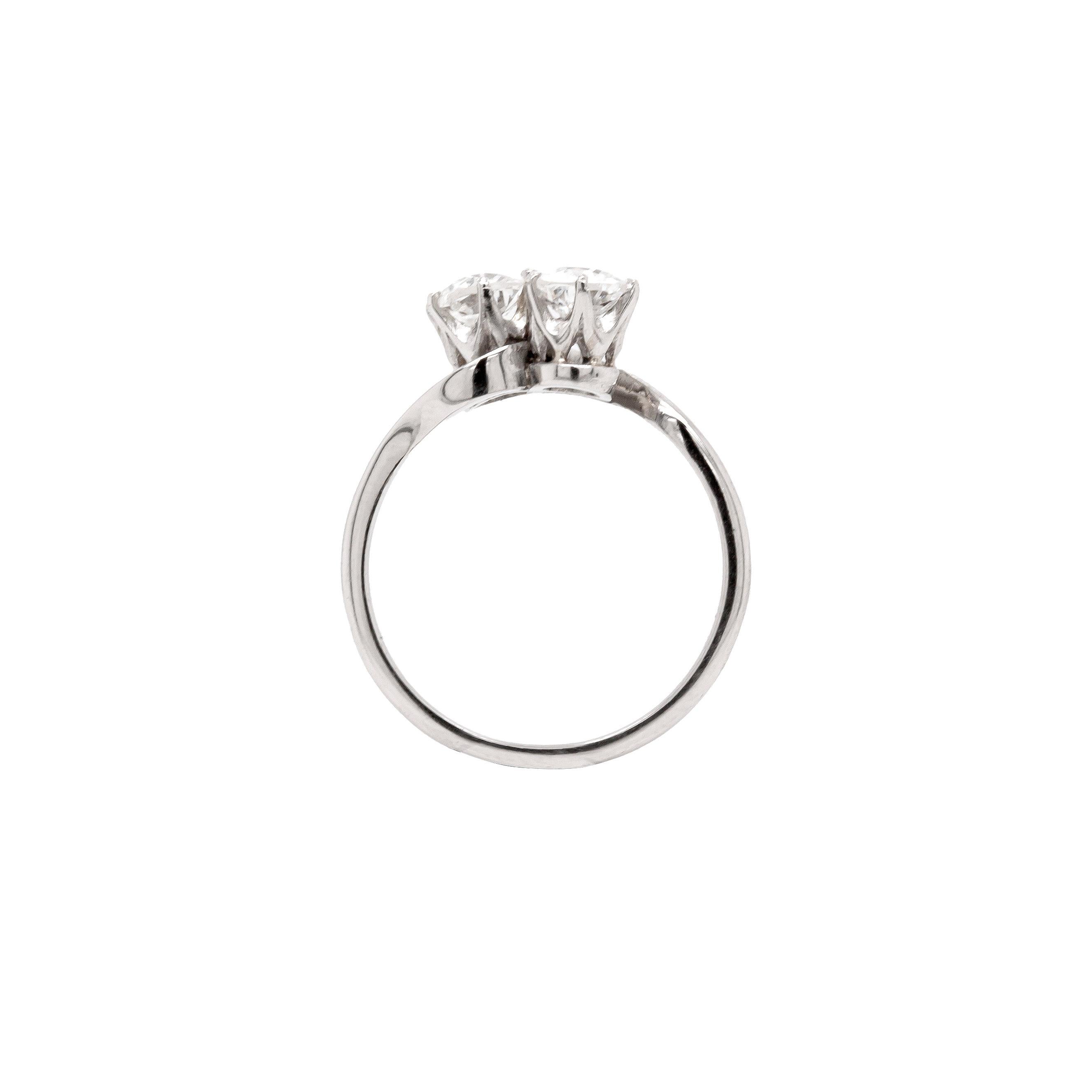 This beautiful antique diamond toi et moi ring transcends time. 

Two stunning semi-old cut diamonds, with a combined weight of 0.81 carats, shine wonderfully at the centre of this fantastic piece. The diamonds are beautifully bright, and are