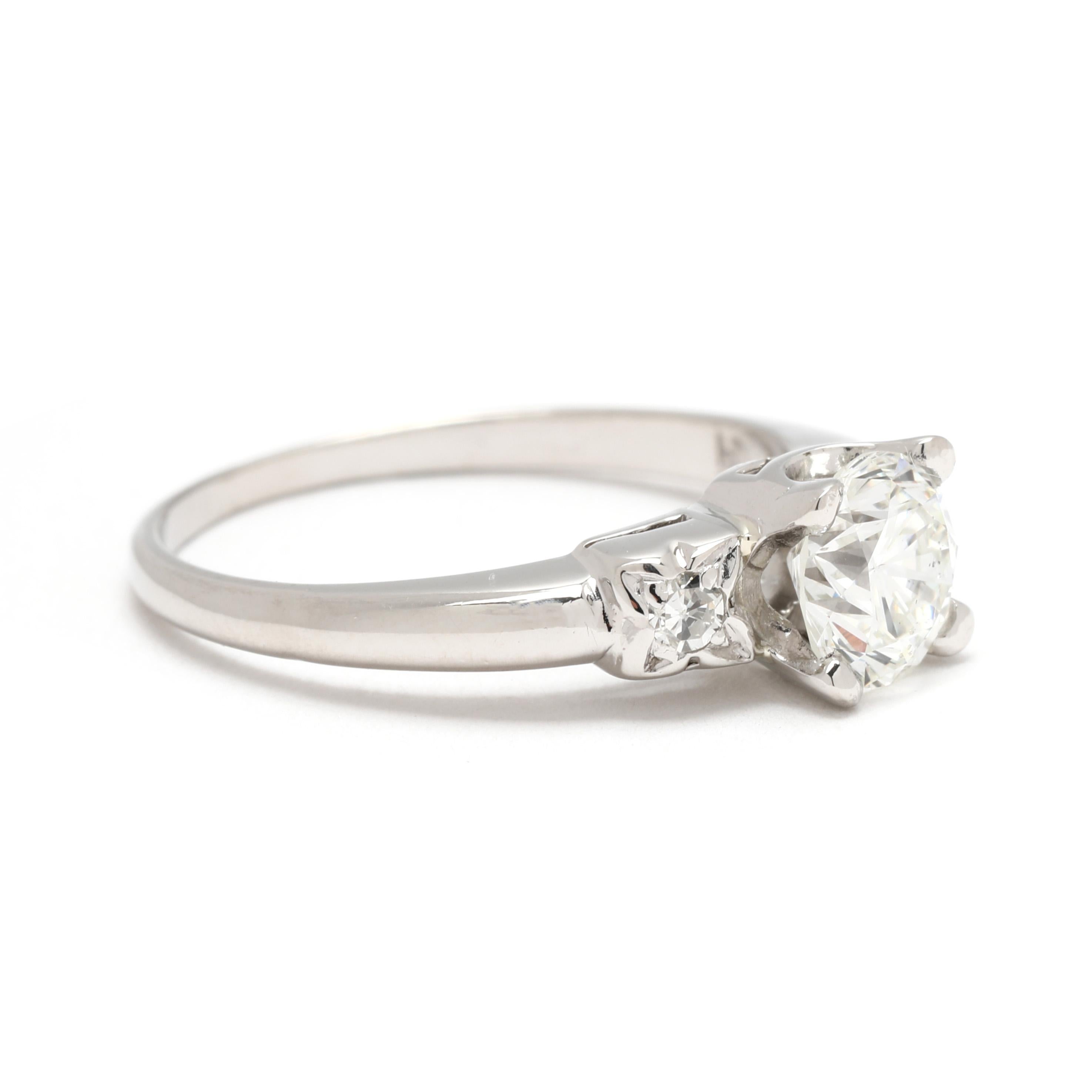 Stones:
diamond
round brilliant cut, 1 stone
5.7 x 5.7 x 3.8 mm
approximately .75 total carats
FG color, SI1 clarity
single cut, 2 stones
2 mm
approximately .06 total carats
FG color, VS2-SI2 clarity

Ring Size 4.75

Length: 5.7 mm

Weight: 2.1