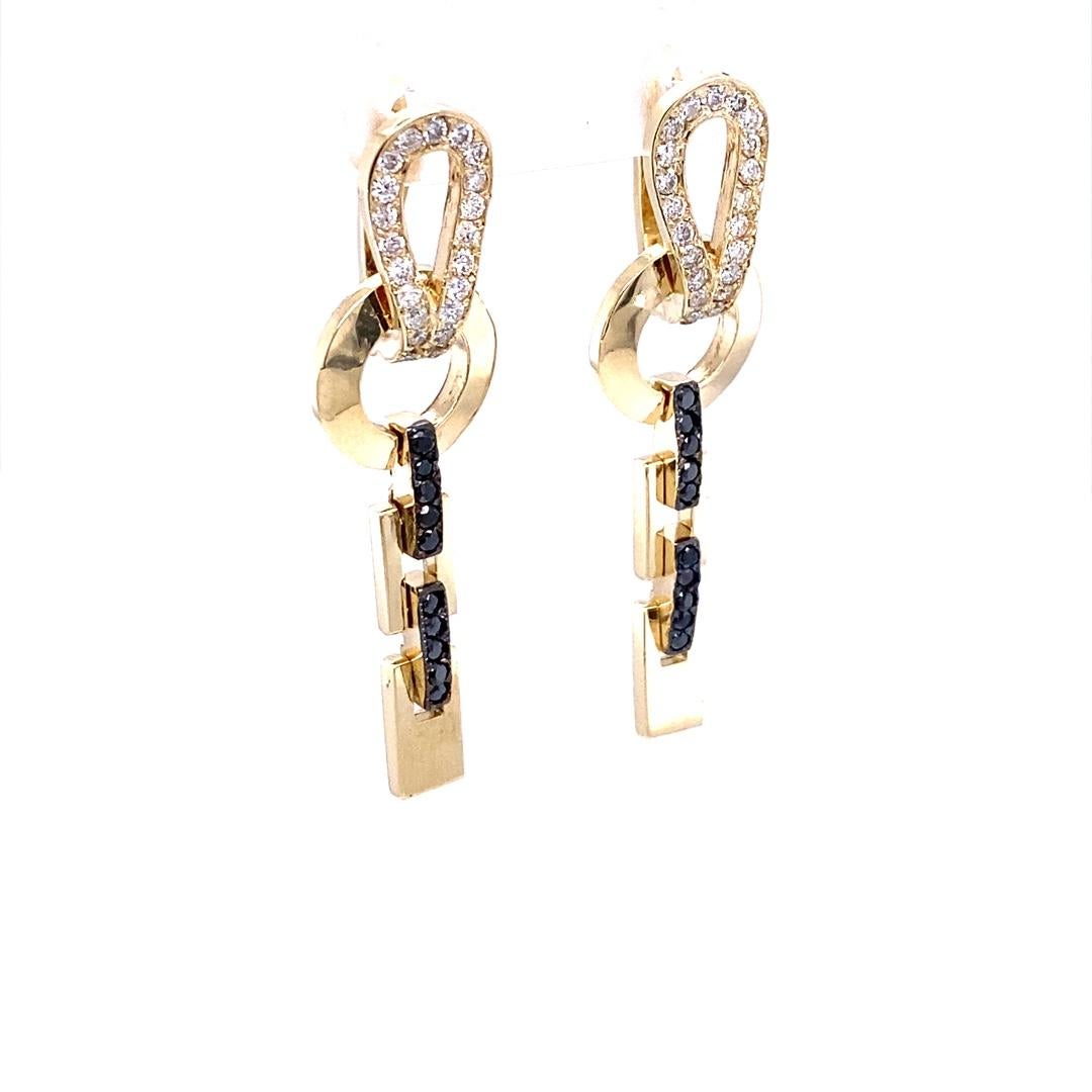 0.82 Carat Diamond 14 Karat Yellow Gold Dangle Earrings

These on trend, yet classic earrings are sure to be a great addition to your accessory collection!  There are 66 White and Black Diamonds that weigh 0.82 Carats (Clarity: SI2, Color: F)
Made