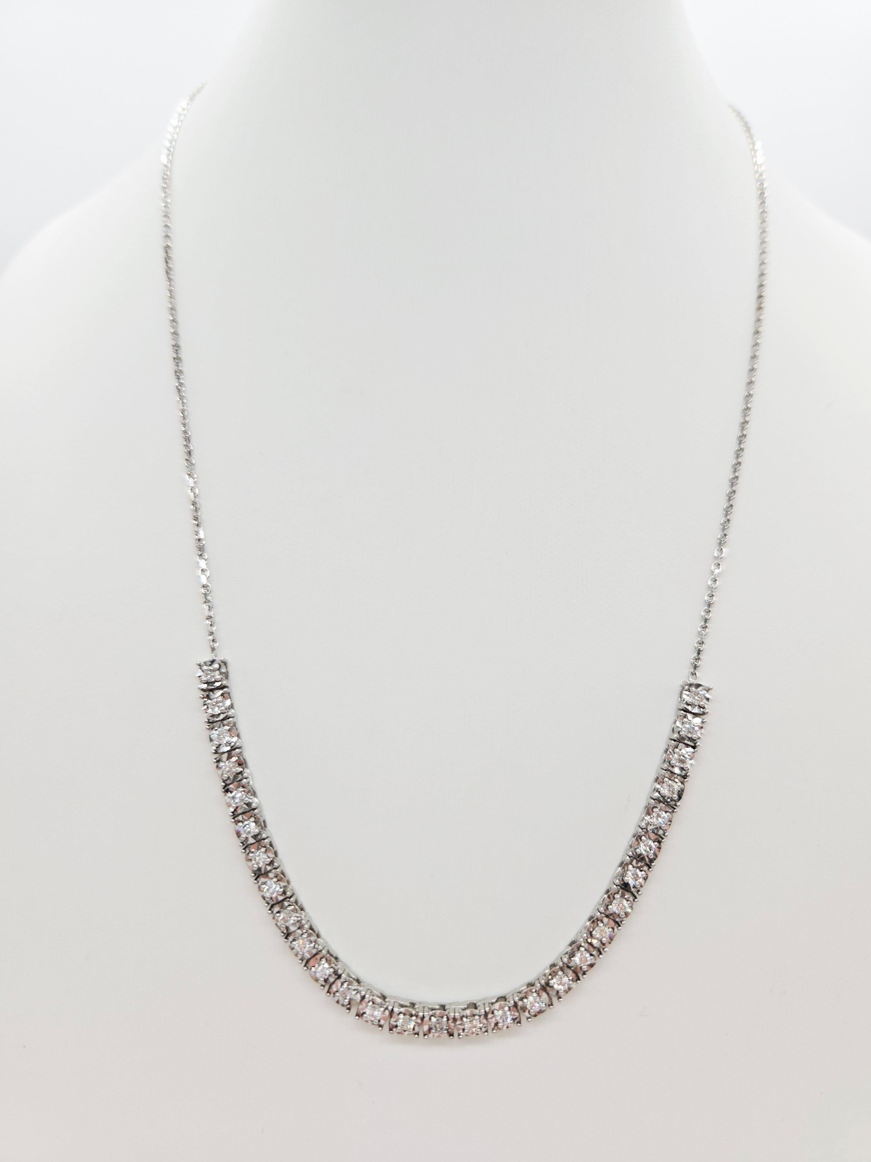 Brilliant and elegant, this mini illusion setting necklace showcases 0.82 carats of natural round-brilliant cut white diamonds with excellent shine and sparkle. Crafted in 14 karat white gold, each diamond is set in a classic four-prong illusion