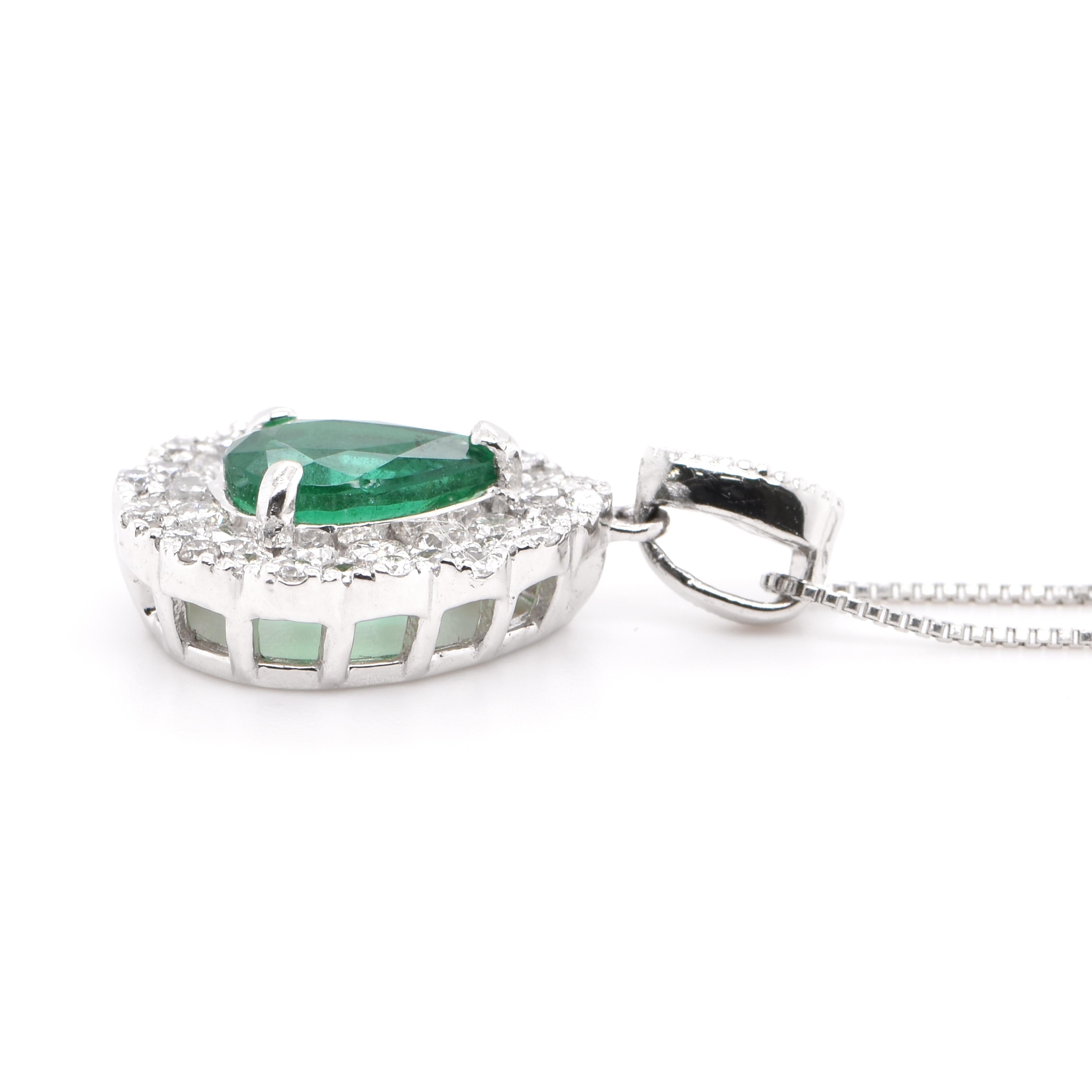 Modern 0.82 Carat Natural Pear-Shape Emerald and Diamond Pendant Set in Platinum