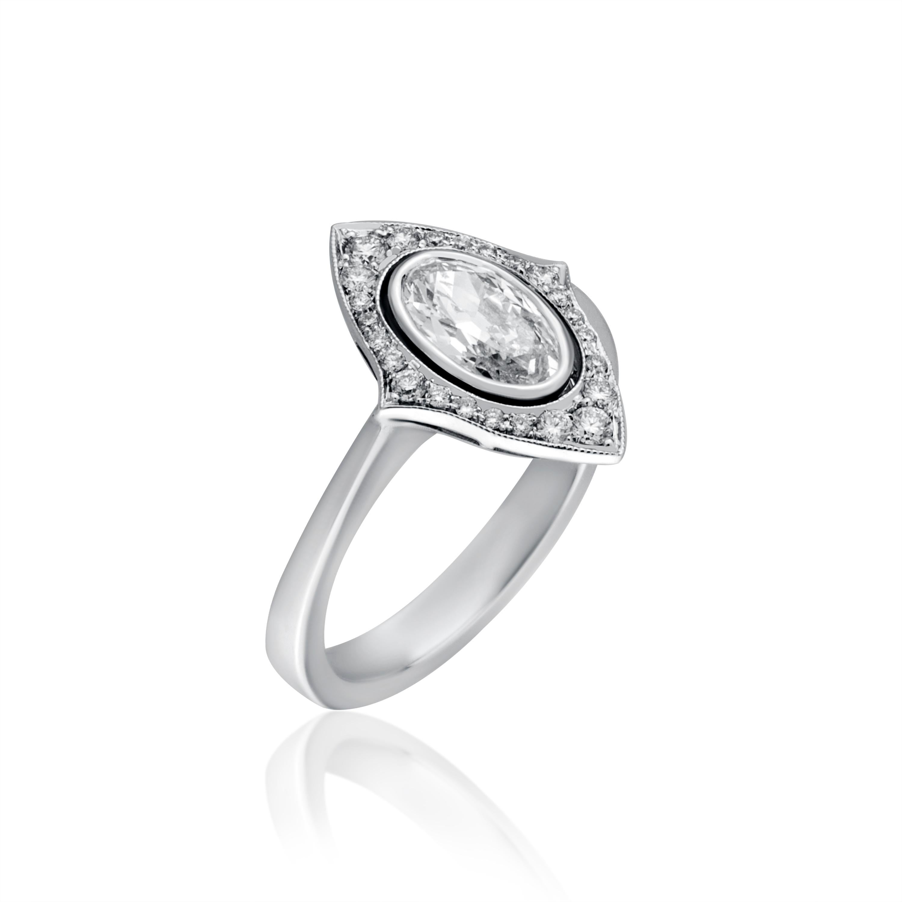 This Beautiful Bridal Ring Features 0.82 Carat Old Cut Oval Diamond In Center Surrounded by 0.18 Carat Small Brilliant Cut Diamonds. Total 1.00 Carat Diamonds Set in 4.70 Gram 18 Karat White Gold.
This Ring Is Made by Hand in Istanbul and