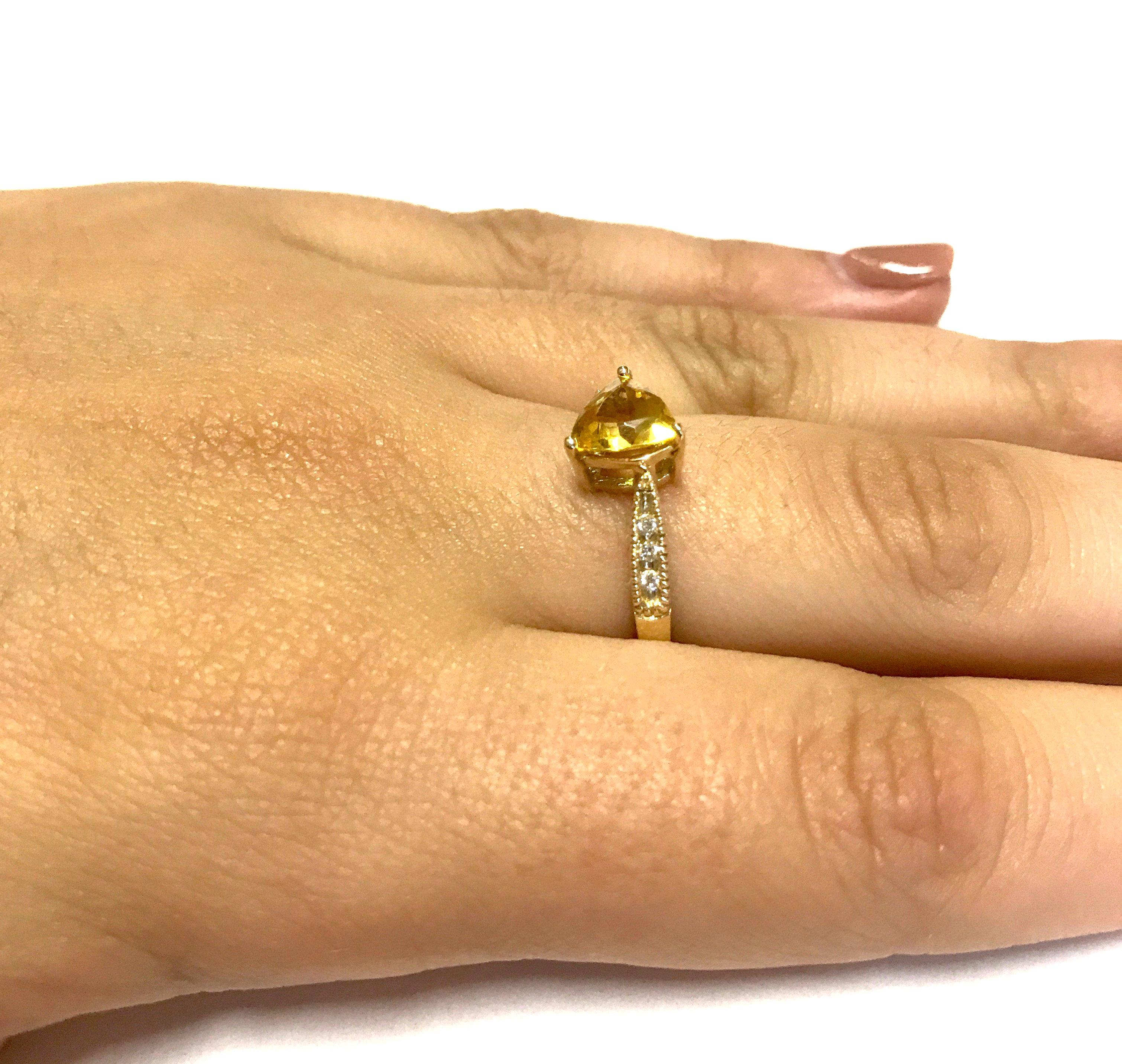 Material: 14k Yellow Gold 
Center Stone Details: 0.82 Carat Trillion Cut Yellow Beryl 
Mounting Diamond Details: 6 Round White Diamonds Approximately 0.07 Carats - Clarity: SI / Color: H-I
Ring Size: 6.5. Alberto offers complimentary sizing on all