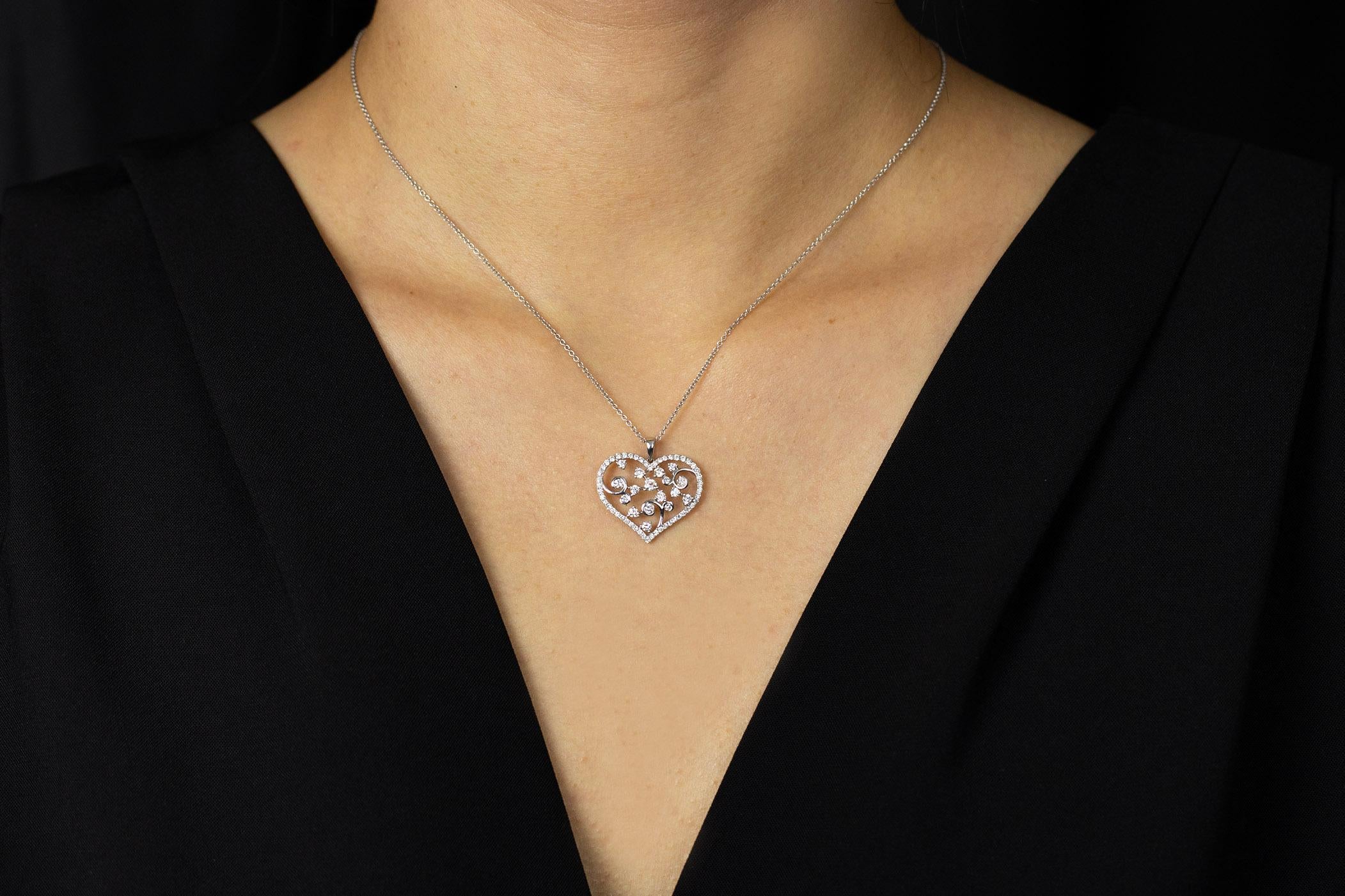 Showcasing this gorgeous 18K white gold heart pendant with an elegant open-work design; set with round brilliant diamonds weighing 0.82 carats total. Finely made in 18K white gold and suspended on an 16 inches adjustable chain.

Roman Malakov is a