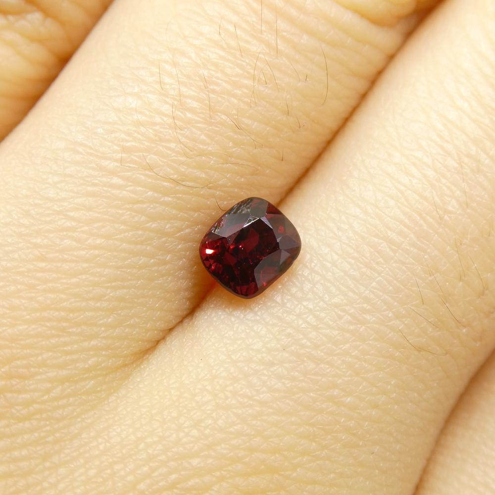 Description:

Gem Type: Jedi Spinel 
Number of Stones: 1
Weight: 0.82 cts
Measurements: 5.17 x 4.54 x 4.25 mm
Shape: Cushion
Cutting Style Crown: Brilliant Cut
Cutting Style Pavilion: Step Cut 
Transparency: Transparent
Clarity: Very Slightly