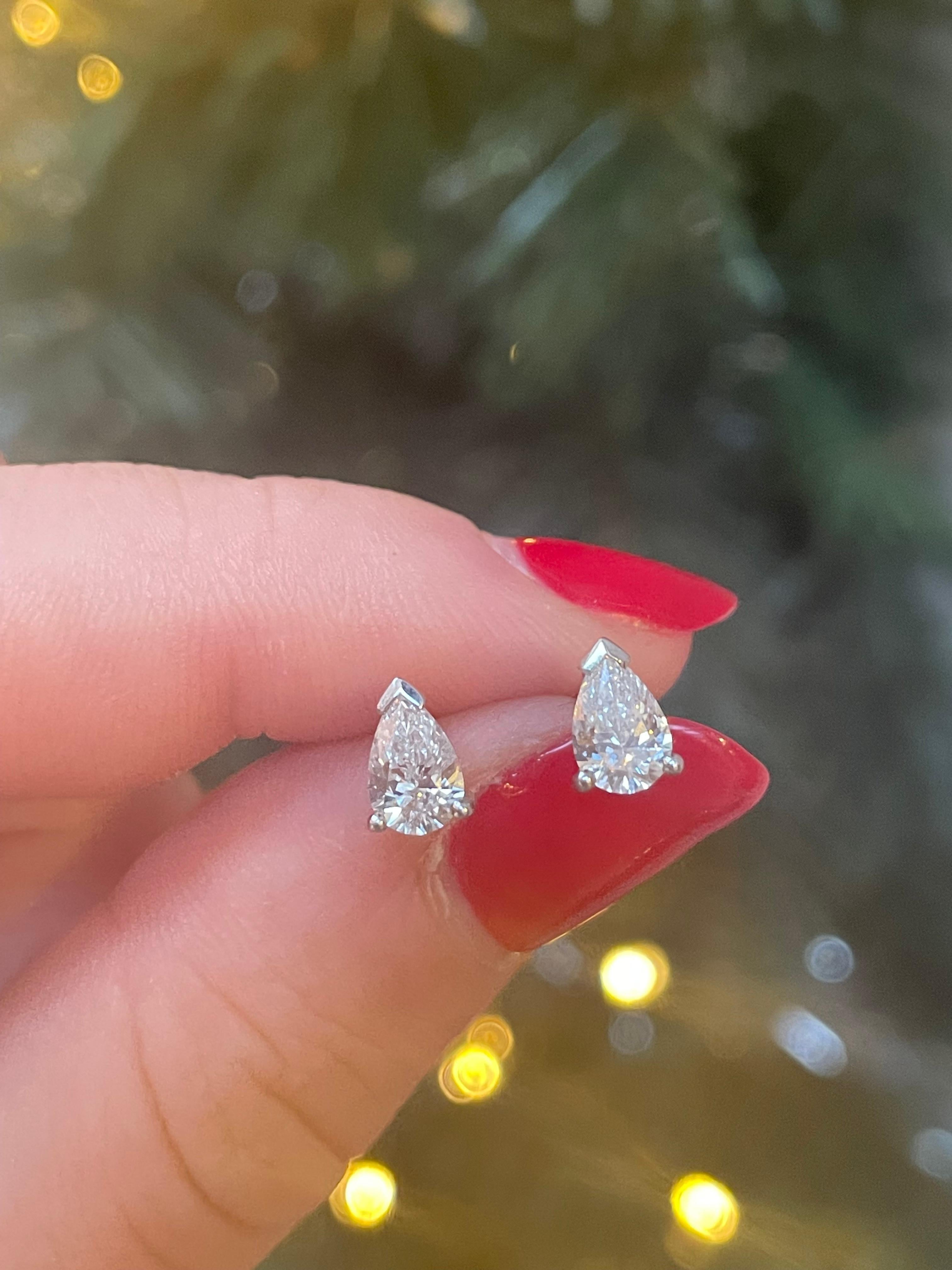 A pair of 0.82ct pear brilliant cut diamond stud earrings in 18 karat white gold.

Each earring is simply set with a pear brilliant cut diamond securely set within three claws. 

A perfect pair of studs to be worn everyday earrings, their pear