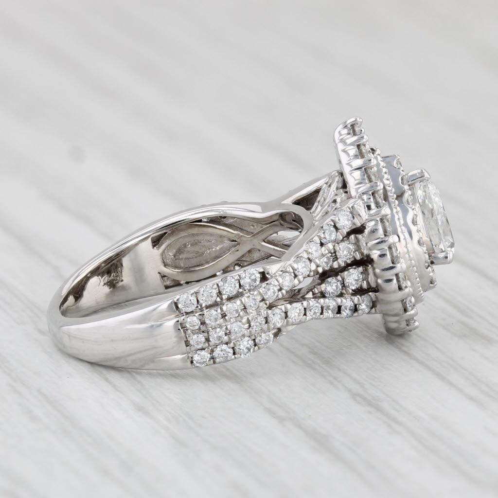 Gemstone Information:
- Natural Diamond (center) -
Carats - 0.27ct 
Cut - Pear Brilliant
Color - I
Clarity - SI2  

- Natural Diamonds (halo & accents) -
Total Carats - 0.24ctw
Cut - Round Brilliant
Color - F - G
Clarity - I1 - I2


Metal: 14k White
