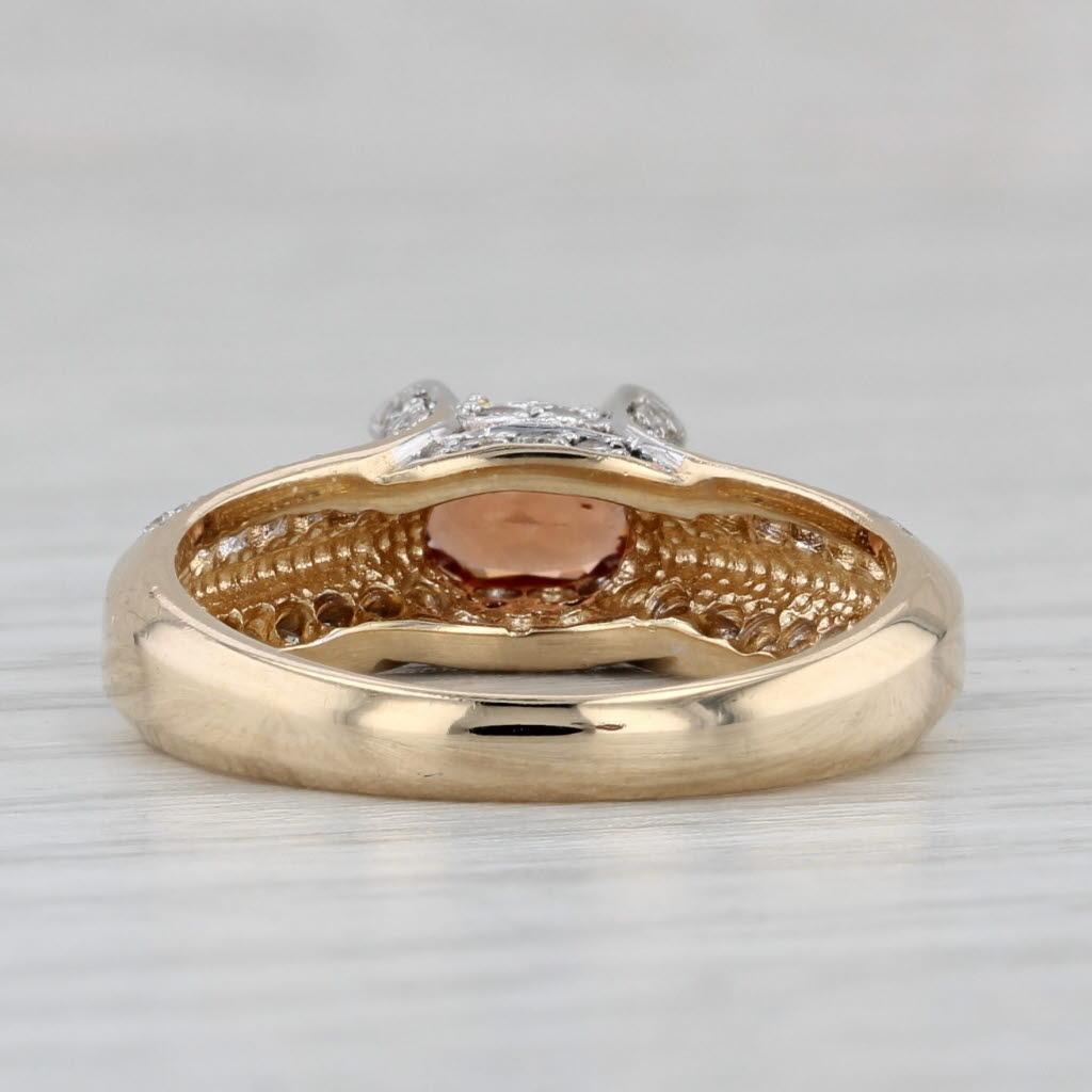 Gemstone Information:
- Natural Spessartite Garnet -
Carats - 0.60ct 
Cut - Oval Brilliant
Color - Orange

- Natural Diamonds -
Total Carats - 0.22ctw
Cut - Round Brilliant
Color - H - I
Clarity - VS2 - SI1

Metal: 14k Yellow Gold
Weight: 4 Grams