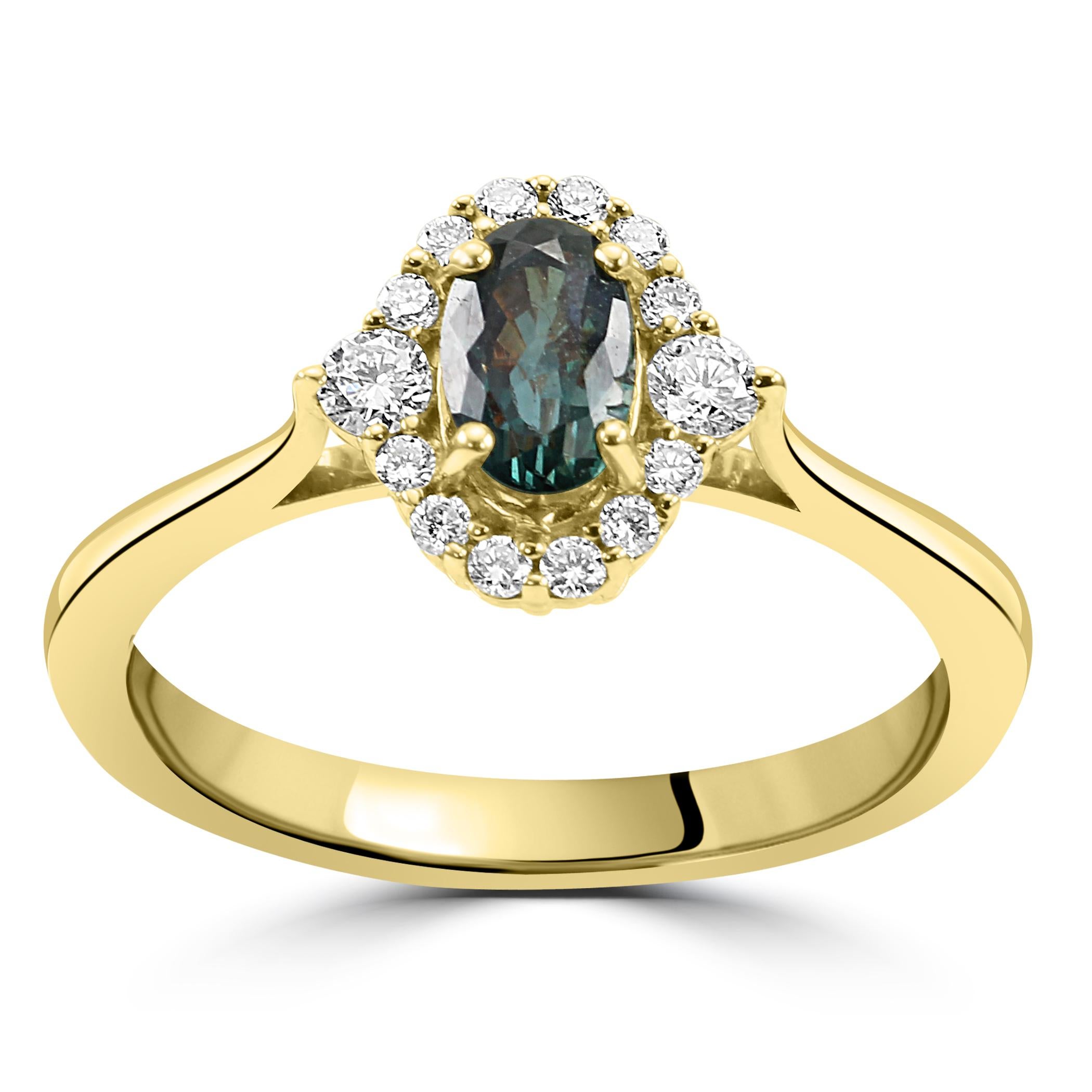 At the heart of this exquisite ring lies a captivating Alexandrite oval, chosen for its remarkable color-changing properties. With a weight of 0.60 carats, this Alexandrite's magnificent lush green hues creates an enchanting visual