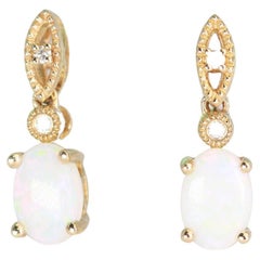 0.83 Carat Australian Opal Oval Cab and Diamond 10K Yellow Gold Stud Earring