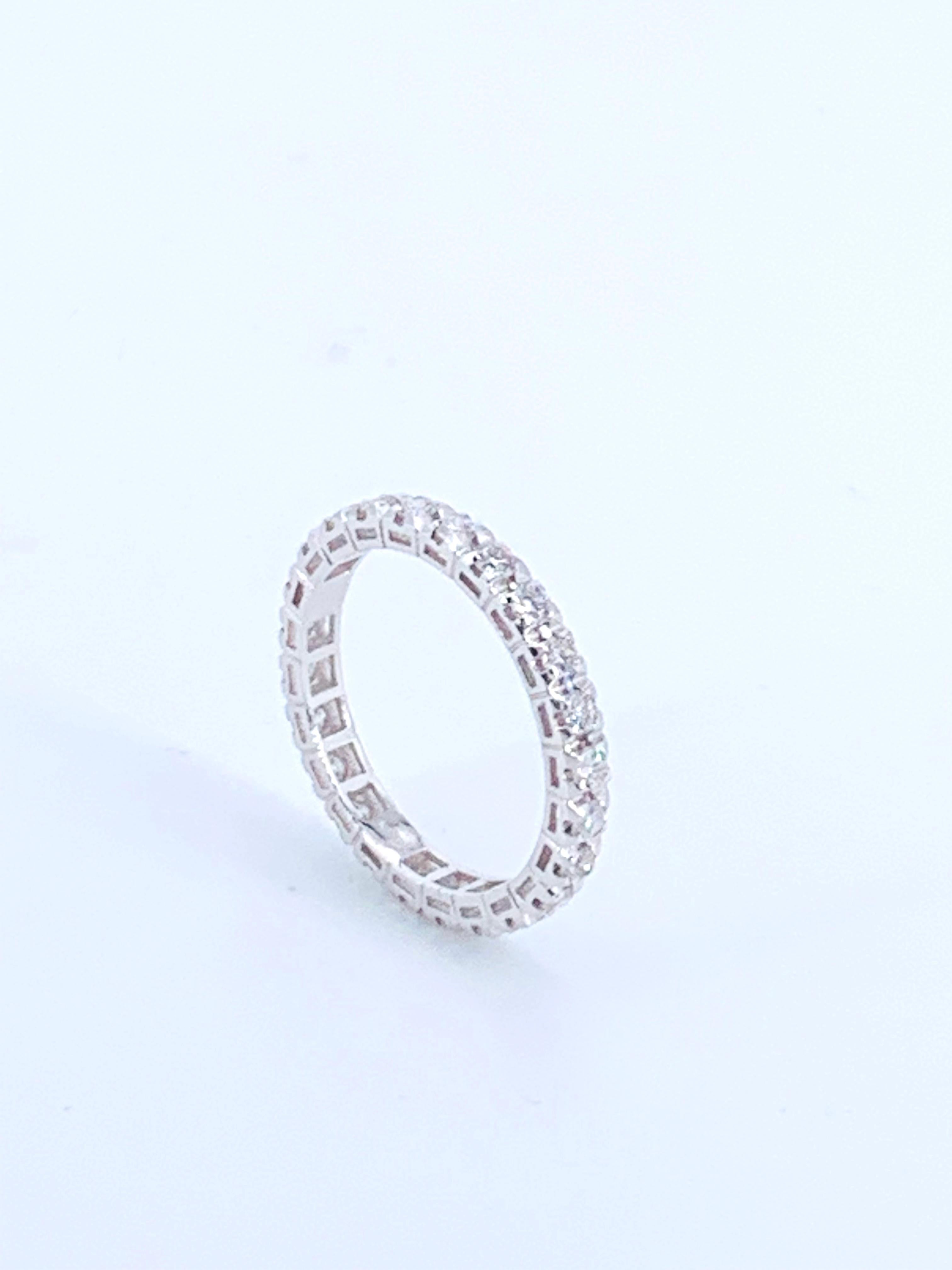 This 0.83 Carat Diamond Eternity Ring is of a fabulous quality and size for either a man or woman. 

It sparkles beautiful natural Diamonds throughout the ring, gifting light and beauty to the finger from every angle. 

Set in 18Kt white Gold it