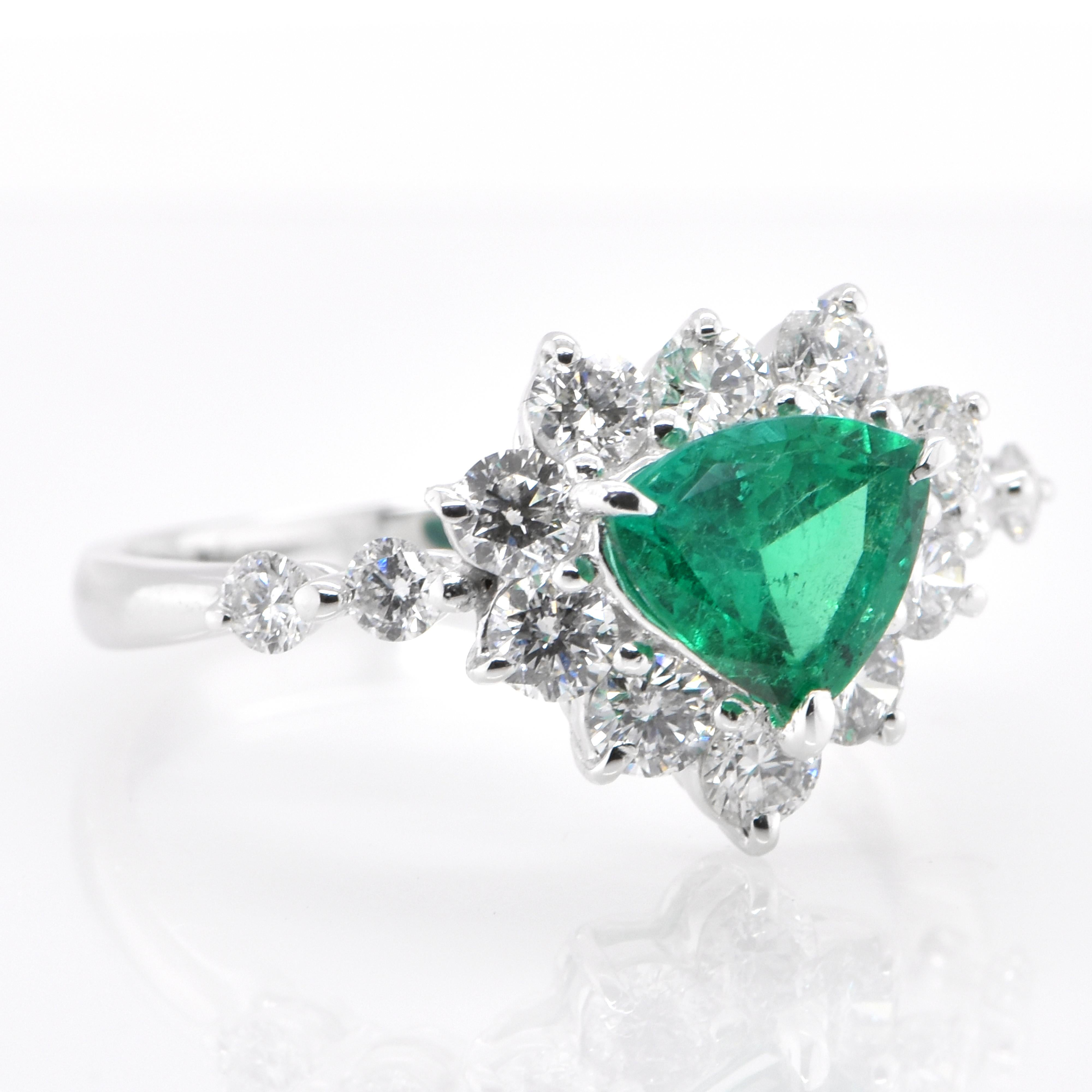 Modern  0.83 Carat Natural, Trillion Cut Emerald and Diamond Ring Set in Platinum For Sale