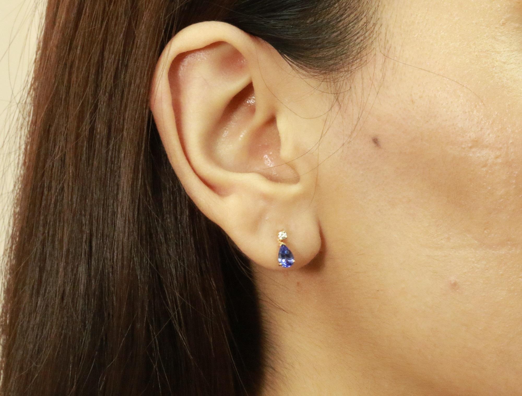 Decorate yourself in elegance with this Earring is crafted from 14K Yellow Gold by Gin & Grace Earring. The jewelry boasts 4X6 Pear-Cut prong setting Genuine Tanzanite (2pcs) 0.83 Carat and Round-Cut prong setting Natural Diamond (2pcs) 0.08 Carat.