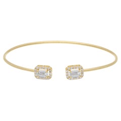 Bracelet manchette en or jaune 18 carats, orné de diamants de 0,83 carat taillés en rond et en émeraude