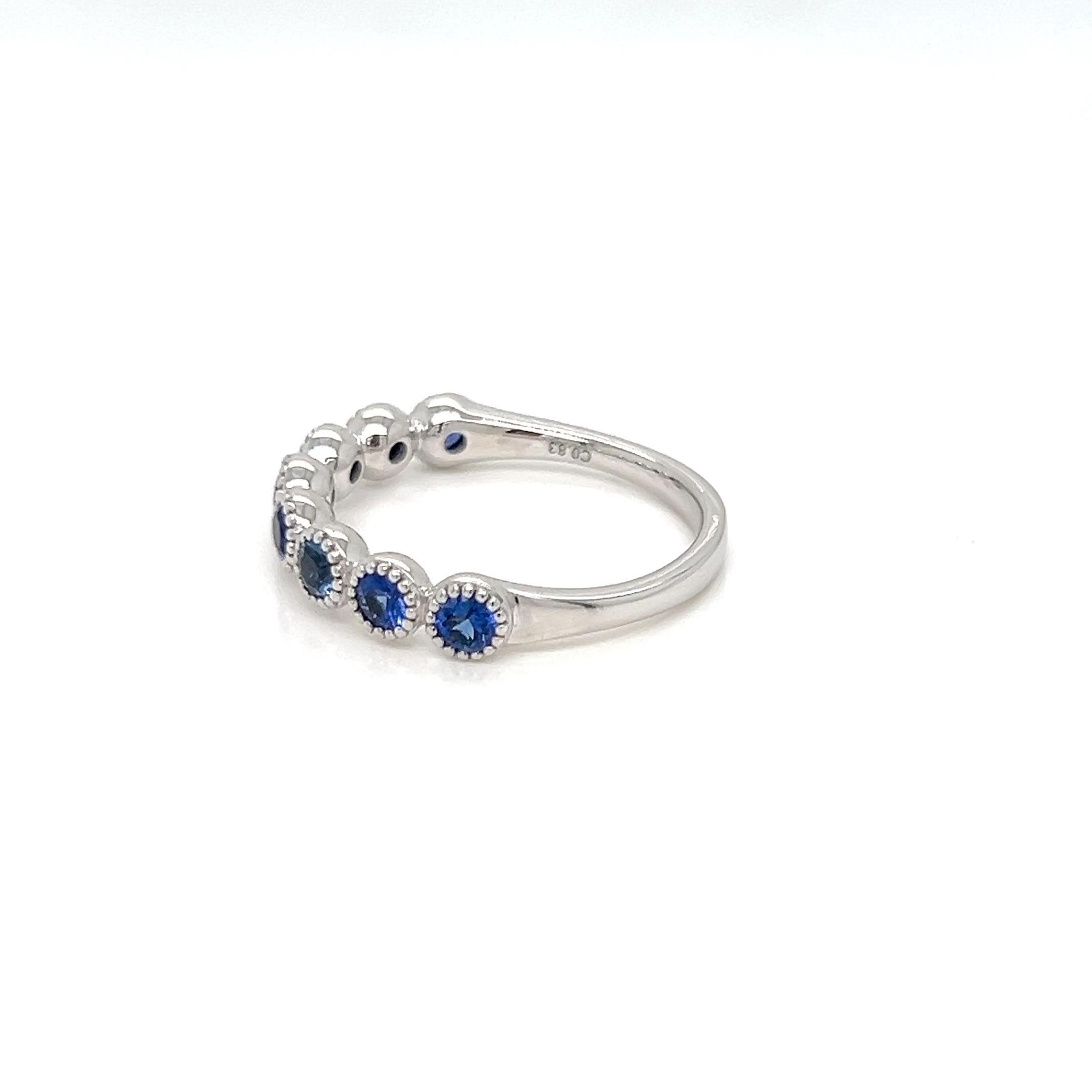 Presenting our magnificent 0.83 Carat Half Eternity Ring in Ceylon Sapphire, a classic design sure to enthrall and fascinate. A stunning array of 0.83 carats of meticulously chosen Ceylon Sapphires, expertly set in a Pave Bead setting, adorn this