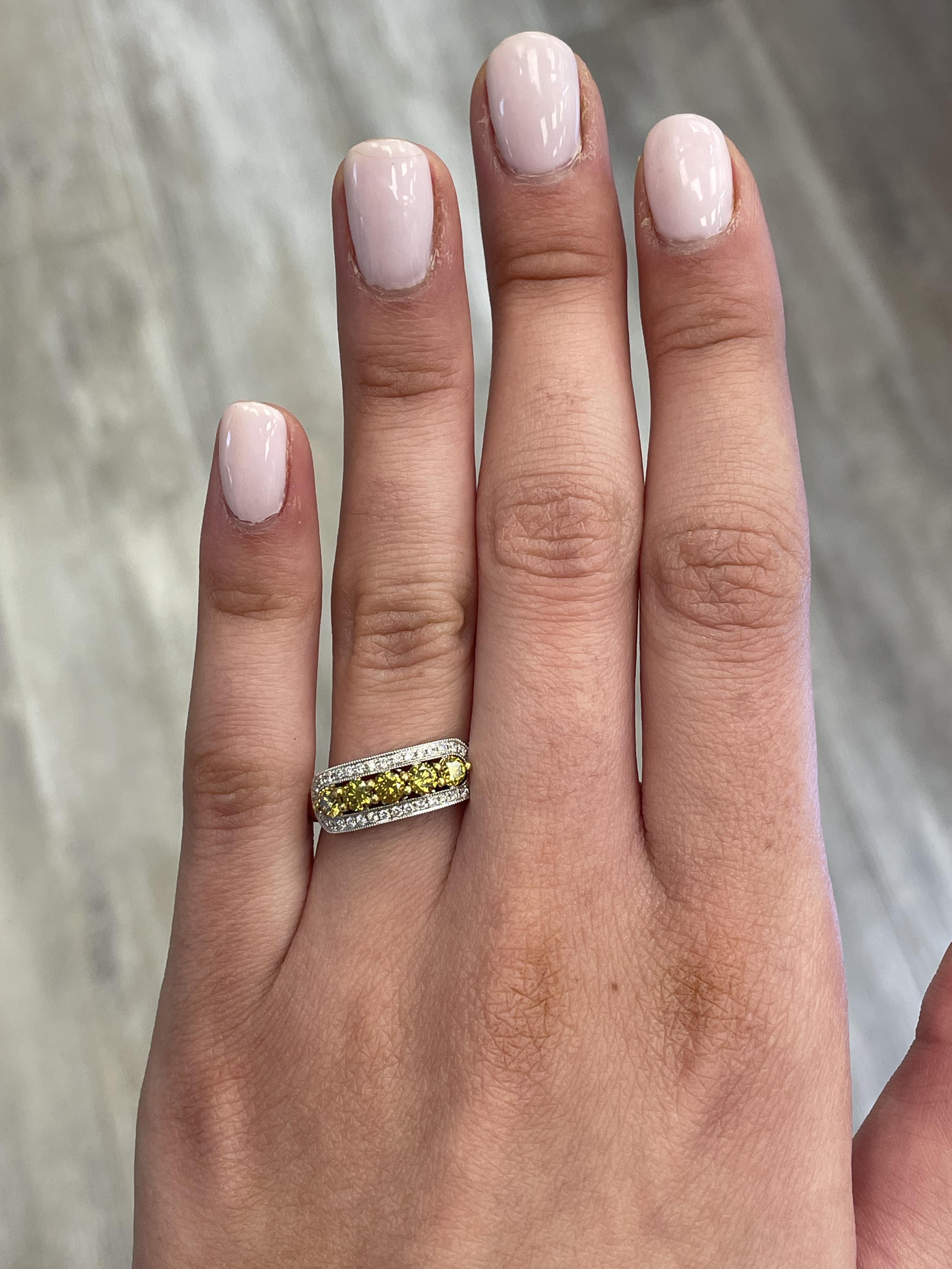 Lovely yellow to brownish yellow diamond cocktail ring.
0.83 carats total diamond weight.
5 round brilliant yellow diamonds, 0.65 carats. Approximately Fancy Brownish Greenish Yellow color and SI clarity. Complimented by 34 round diamonds, 0.18
