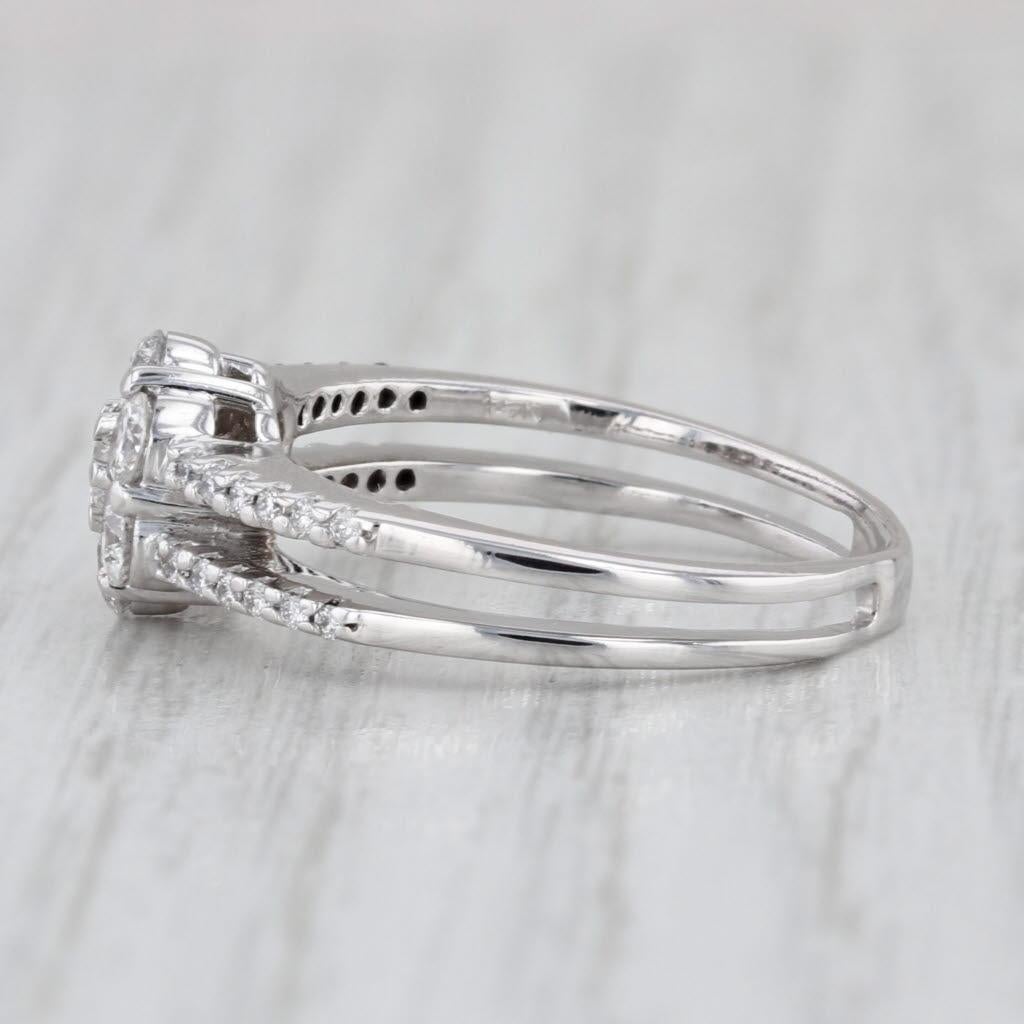 Gemstone Information:
- Natural Diamonds -
Total Carats - 0.83ctw 
Cut - Round Brilliant
Color - E - G
Clarity - SI1 - I1

Metal: 14k White Gold
Weight: 3.6 Grams 
Stamps: 14k
Face Height: 8.5 mm 
Rise Above Finger: 5.2 mm
Band / Shank Width: 3