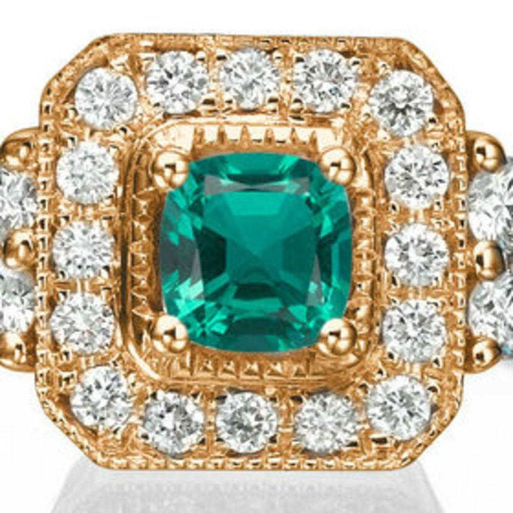 A beautiful halo Emerald engagement ring made of 14K Rose Gold set with a Round cut Emerald of 0.50 carat accented by 16 natural round diamonds.
 The center stone of this unique engagement ring is of excellent cut, green color. The total carat