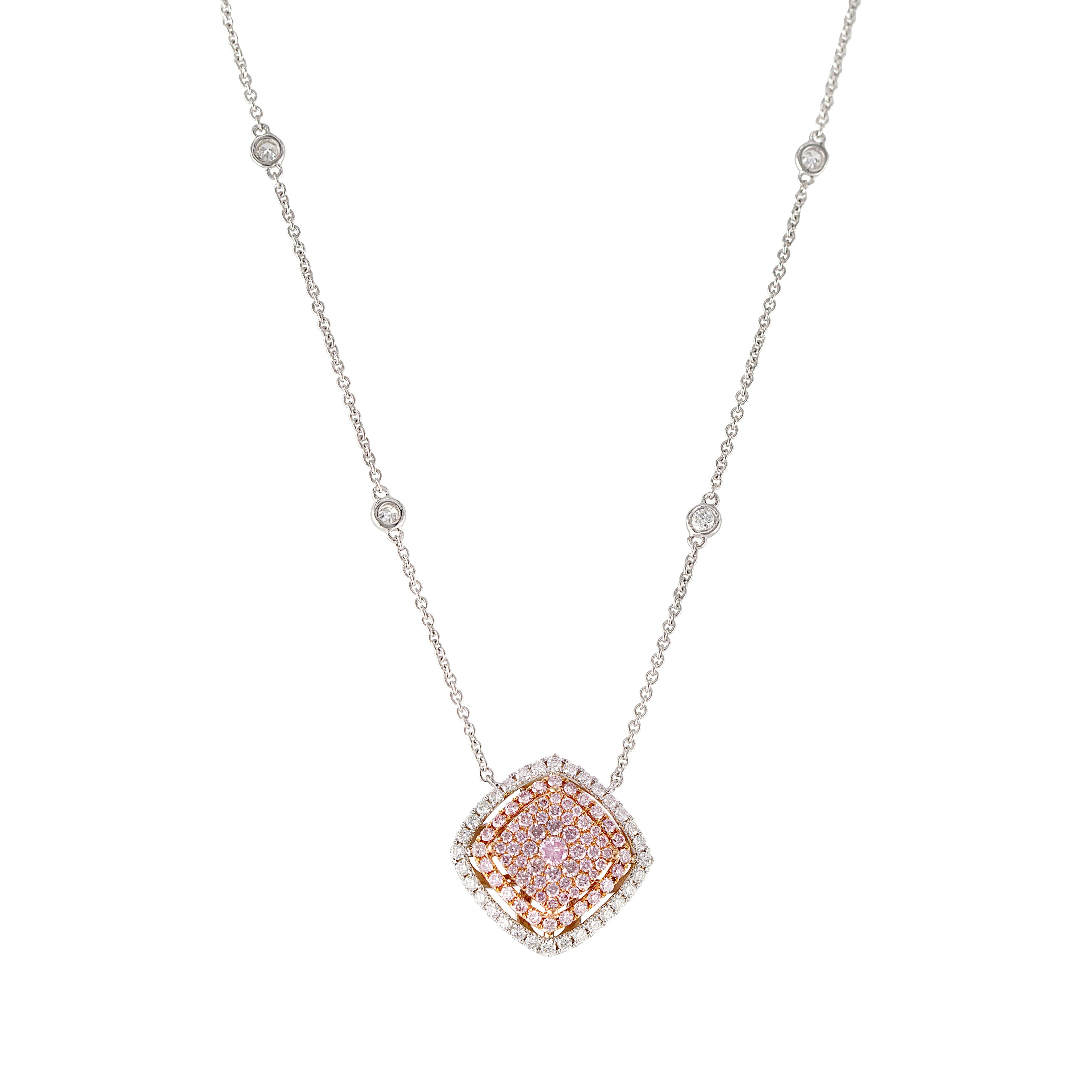Elegance knows no bounds with our mesmerizing Pink Diamond Pendant. In its heart, an ensemble of multiple round pink diamonds meticulously conveys the allure of a perfect cushion shape, cradled by a radiant halo of round white diamonds. The 18-inch