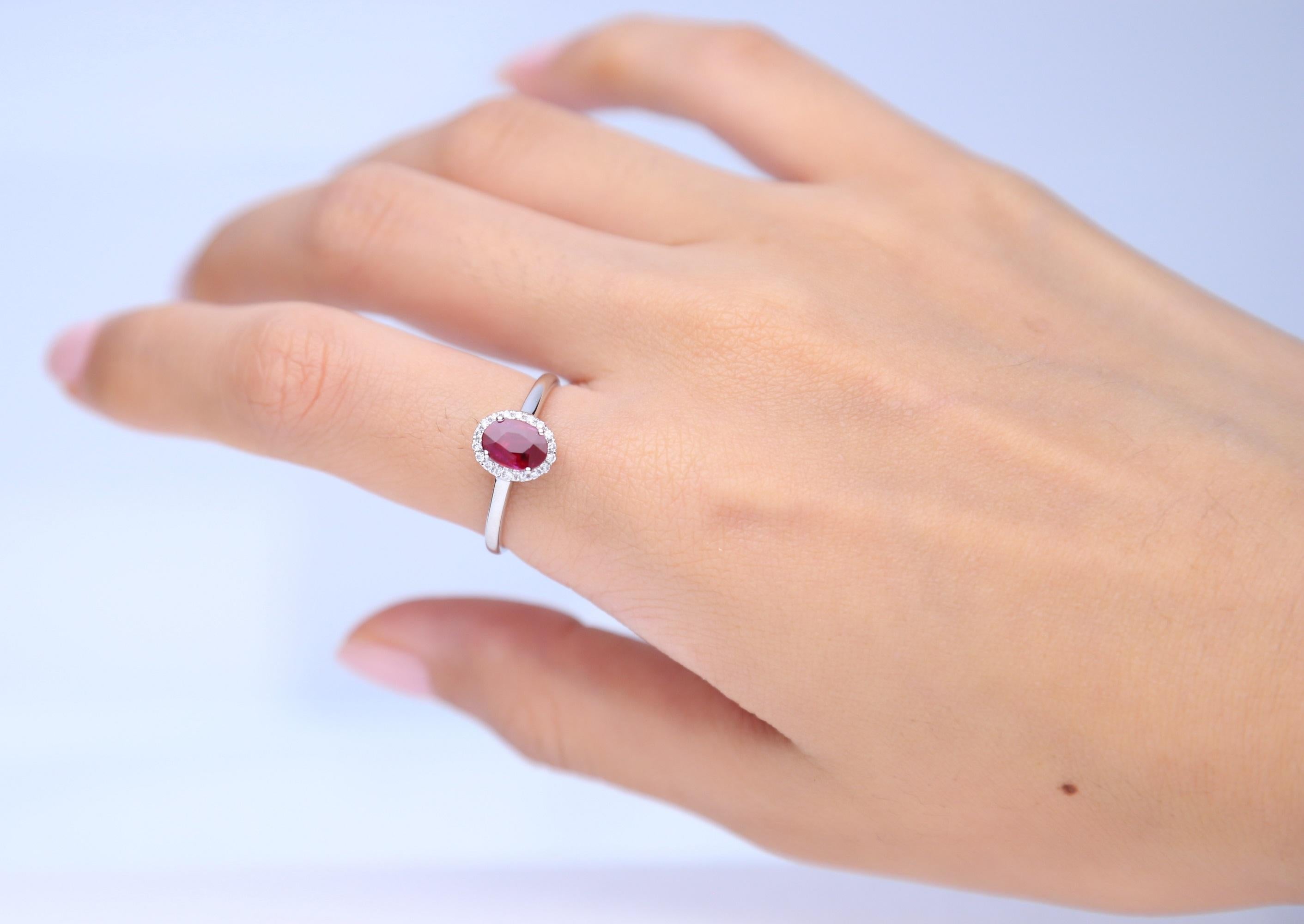 Decorate yourself in elegance with this Ring is crafted from 10-karat White Gold by Gin & Grace. This Ring is made up of Oval-Cut Ruby (1 pcs) 0.84 carat and Round-cut White Diamond (18 Pcs) 0.10 Carat. This Ring is weight 1.88 grams. This delicate