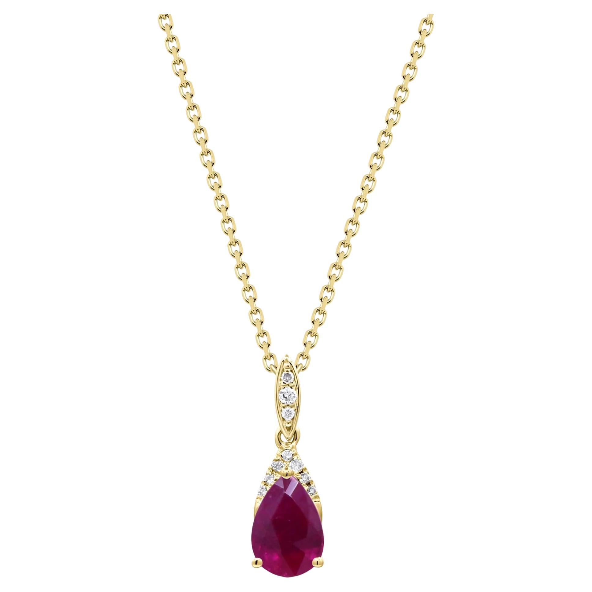 0.78 Carat Pear-Cut Ruby with Diamond Accents 10K Yellow Gold Pendant For Sale