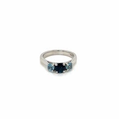 0.84 Carat Round Sapphire and 0.45 Carat Aquamarine Three Stone Ring in Platinum