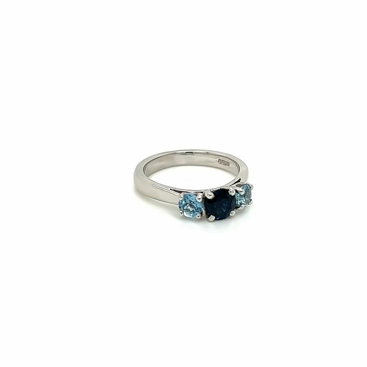Round Cut 0.84 Carat Round Sapphire and 0.45 Carat Aquamarine Three Stone Ring in Platinum For Sale