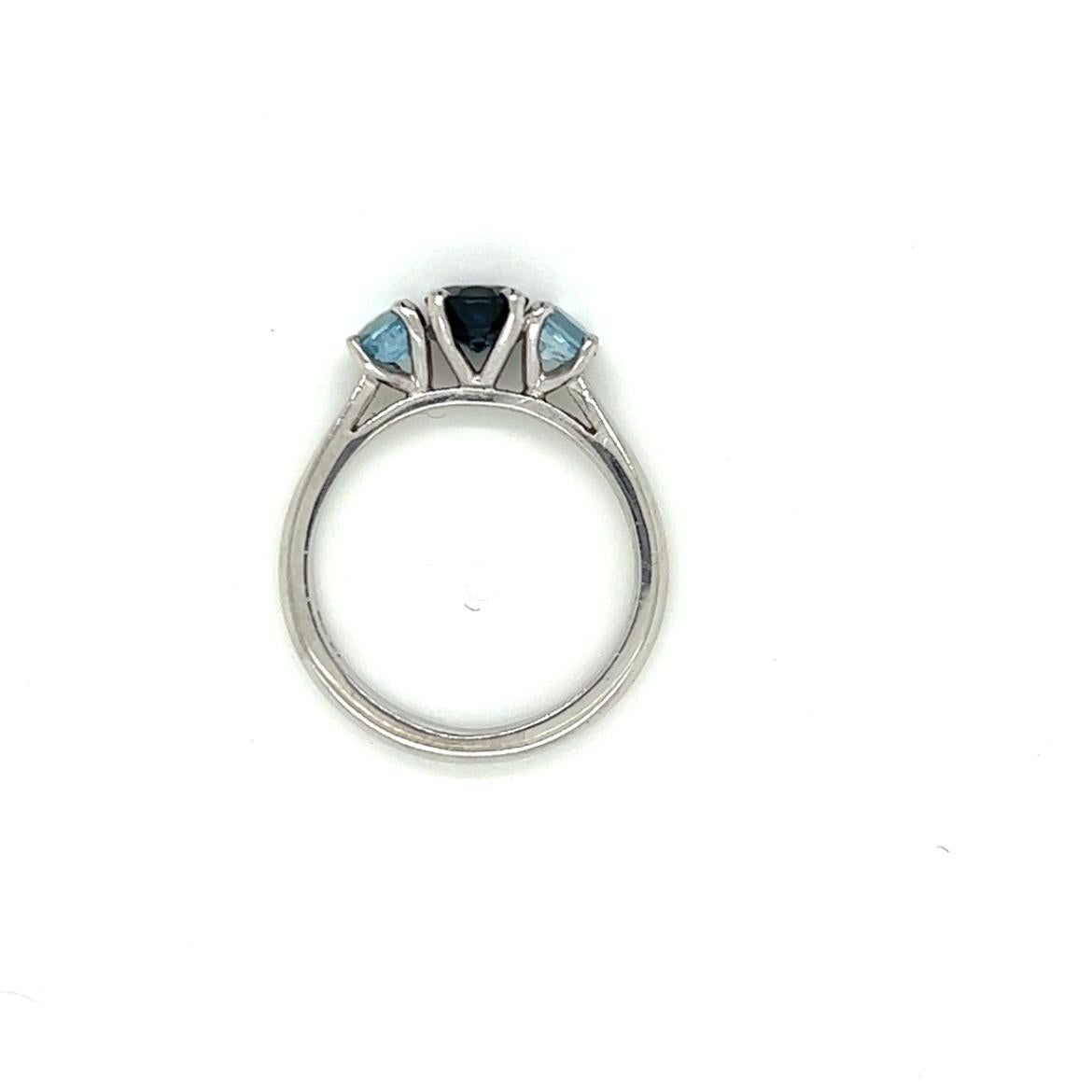 Women's 0.84 Carat Round Sapphire and 0.45 Carat Aquamarine Three Stone Ring in Platinum For Sale