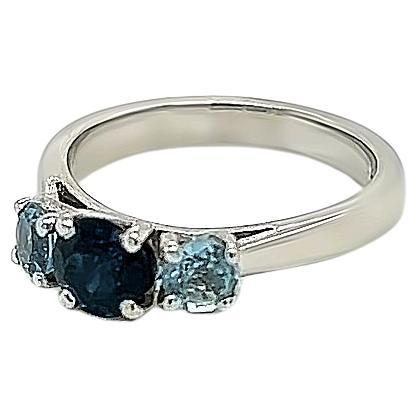 0.84 Carat Round Sapphire and 0.45 Carat Aquamarine Three Stone Ring in Platinum For Sale