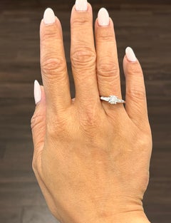 0.84 Carat Round Diamond and Trapezoid Diamond Engagement Ring