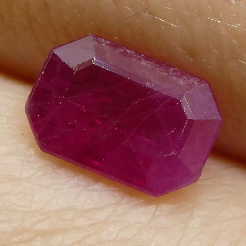 Description:

Gem Type: Ruby
Number of Stones: 1
Weight: 0.84 cts
Measurements: 6.82x4.74x2.45 mm
Shape: Emerad
Cutting Style Crown: Step Cut
Cutting Style Pavilion: Step Cut
Transparency: Translucent
Clarity: Heavily Included: Inclusions prominant