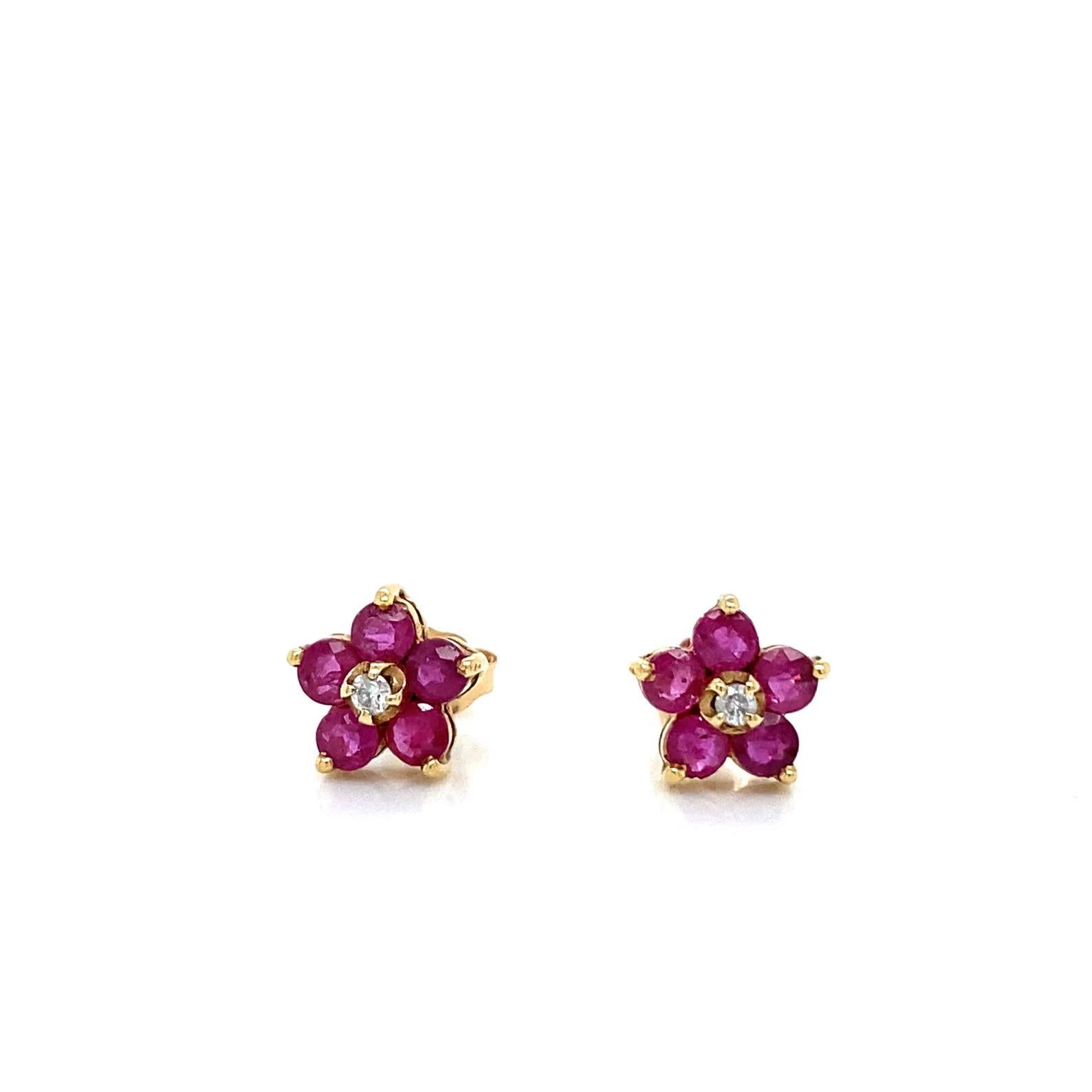 0.84 Total Carat Ruby and Diamond Flower Shaped Push Back Earrings in 14K Gold

These classic earrings feature 0.80 carats of Ruby and .04 carats of Diamond set in 14K Yellow Gold. These beautiful earrings were proudly made in New York City. 
Orders