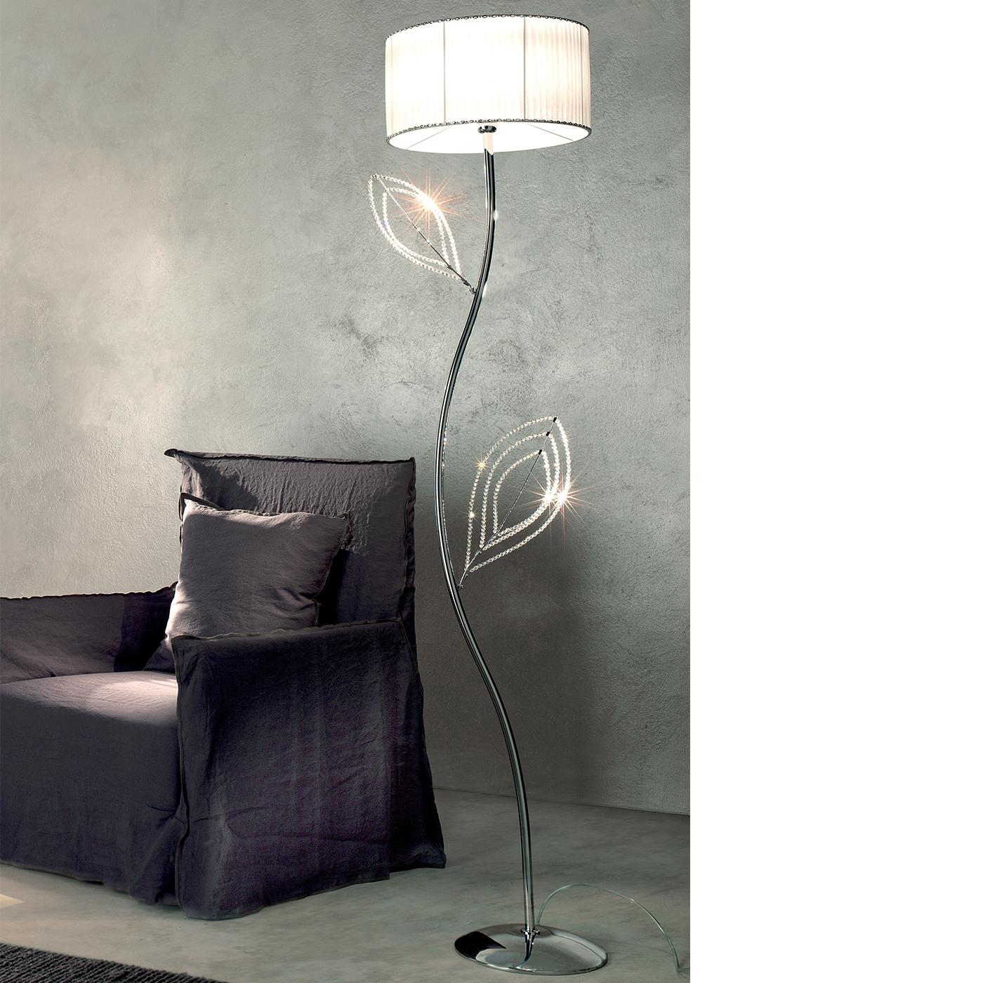 This delightful floor lamp features an intricate and charming design. Representing the form of a flower with a stem and leaves, the lighting fixture offers an element of fun and delicate creativity to any contemporary style room and is crafted in