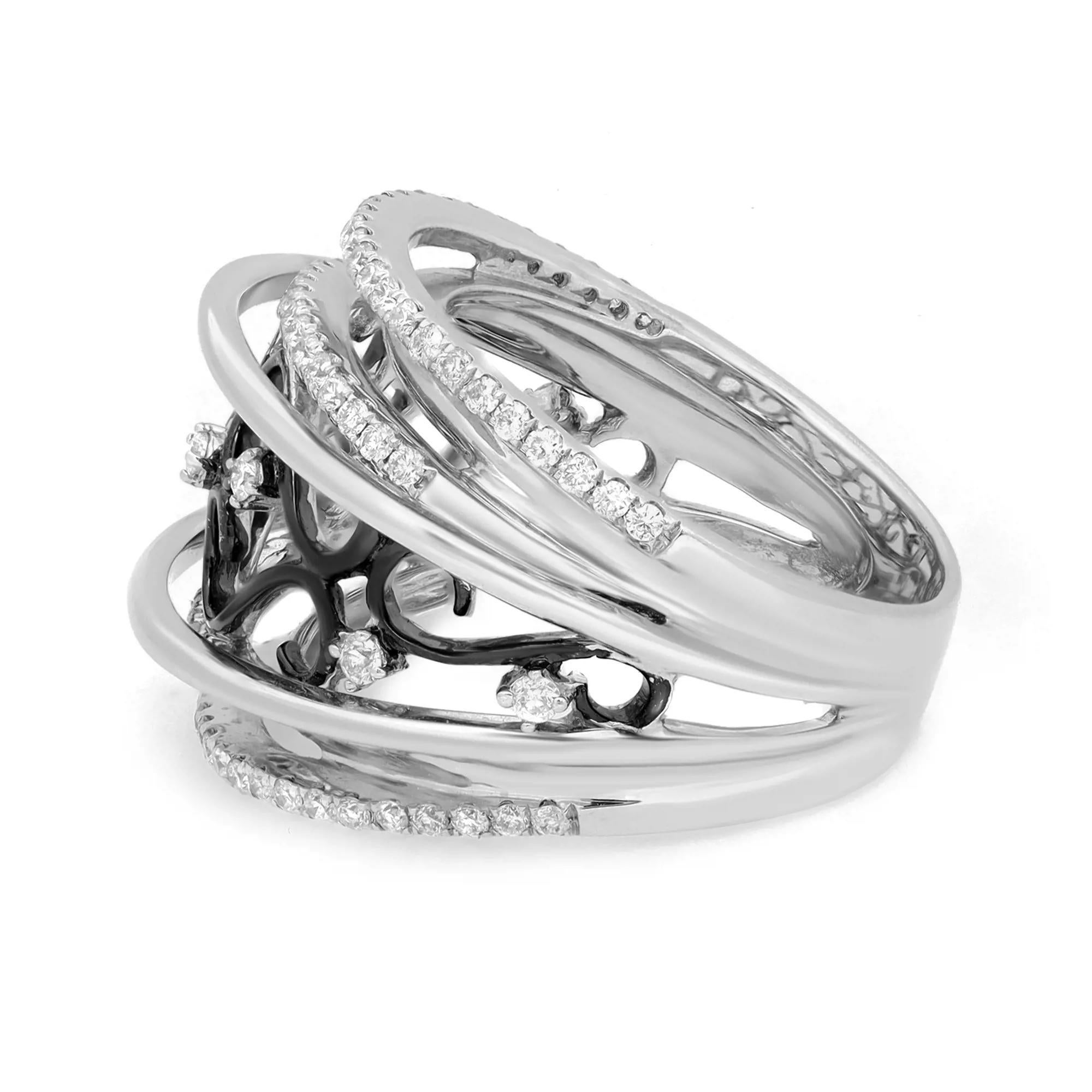 This stunning one of a kind wide cocktail band ring is crafted in 14k white gold. It features dark rhodium plated intricate filigree design with prong set round brilliant cut diamonds weighing 0.84 carat. Ring size: 7.25. Total weight: 13.43 grams.