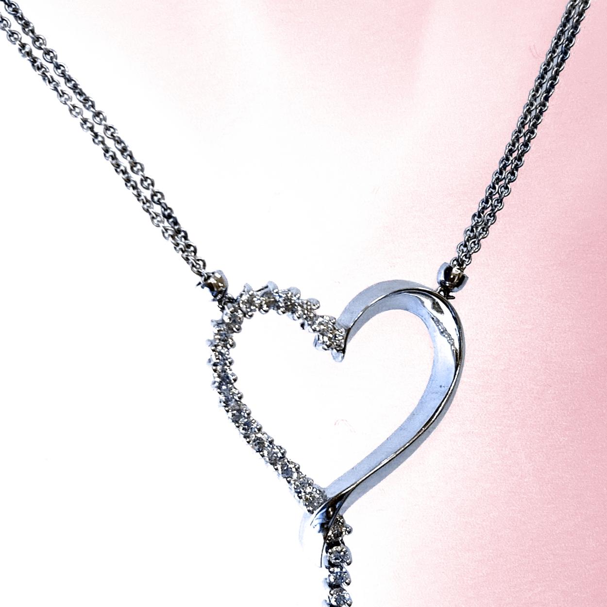 14K Gold Pave Set Diamond Heart Necklace on double strand chain. 35 pieces of 1.7mm Round Brilliant diamonds with total Diamond Weight of 0.85 Ct. 
Total Diamond Weight: 0.85 Ct
Total Necklace Weight: 9.55 gr
Heart Pendant Size 25x25 mm
Dangle