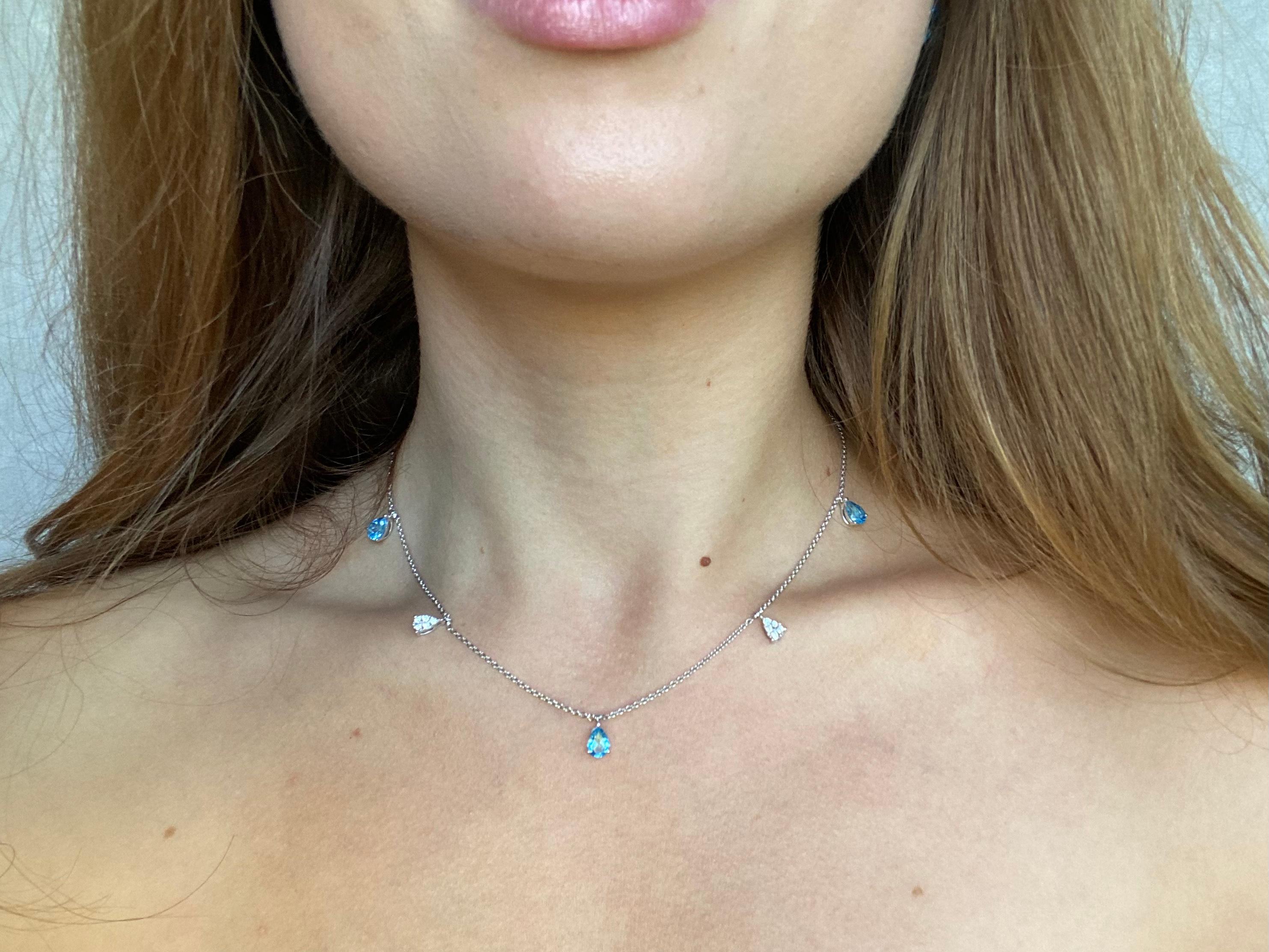 This blue topaz diamond chocker necklace is perfect for all of you who love delicate designs. The 3 drop shaped blue topaz bring to mind images of luxurious landscapes of French Riviera or Maldives blue water. The Swiss blue hue has a noble